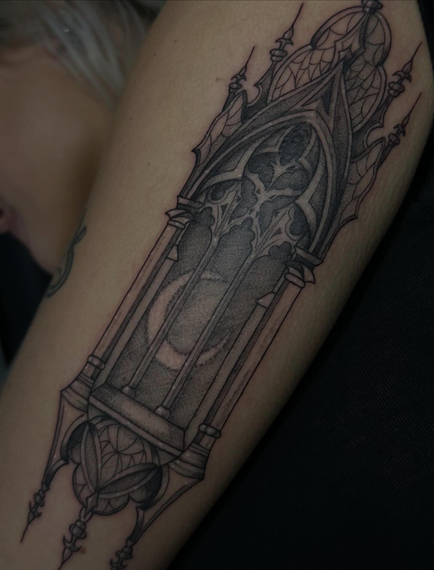 Gothic cathedral geometric tattoo on the forearm by Maddie Neibert