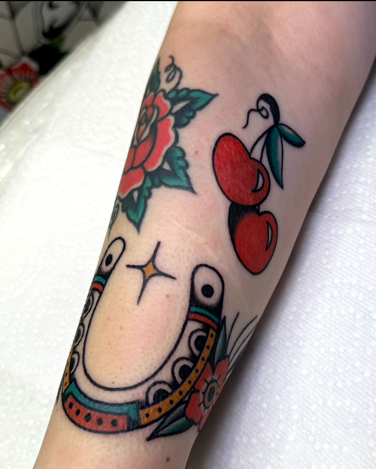 Rose and cherries American traditional tattoo on the forearm by ＊ Carly James ＊