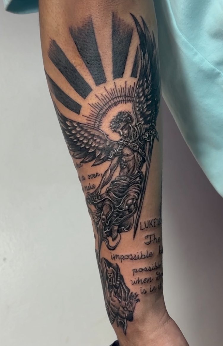Angel with sword and scripture realism tattoo on the forearm by Gerd thINK_TATTOO