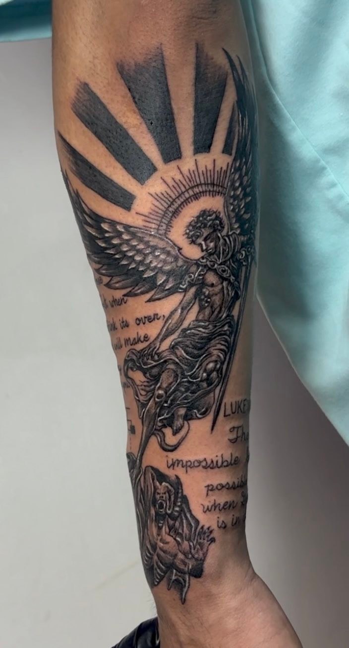 Angel fighting demon with scripture realism tattoo on the forearm by Gerd thINK_TATTOO
