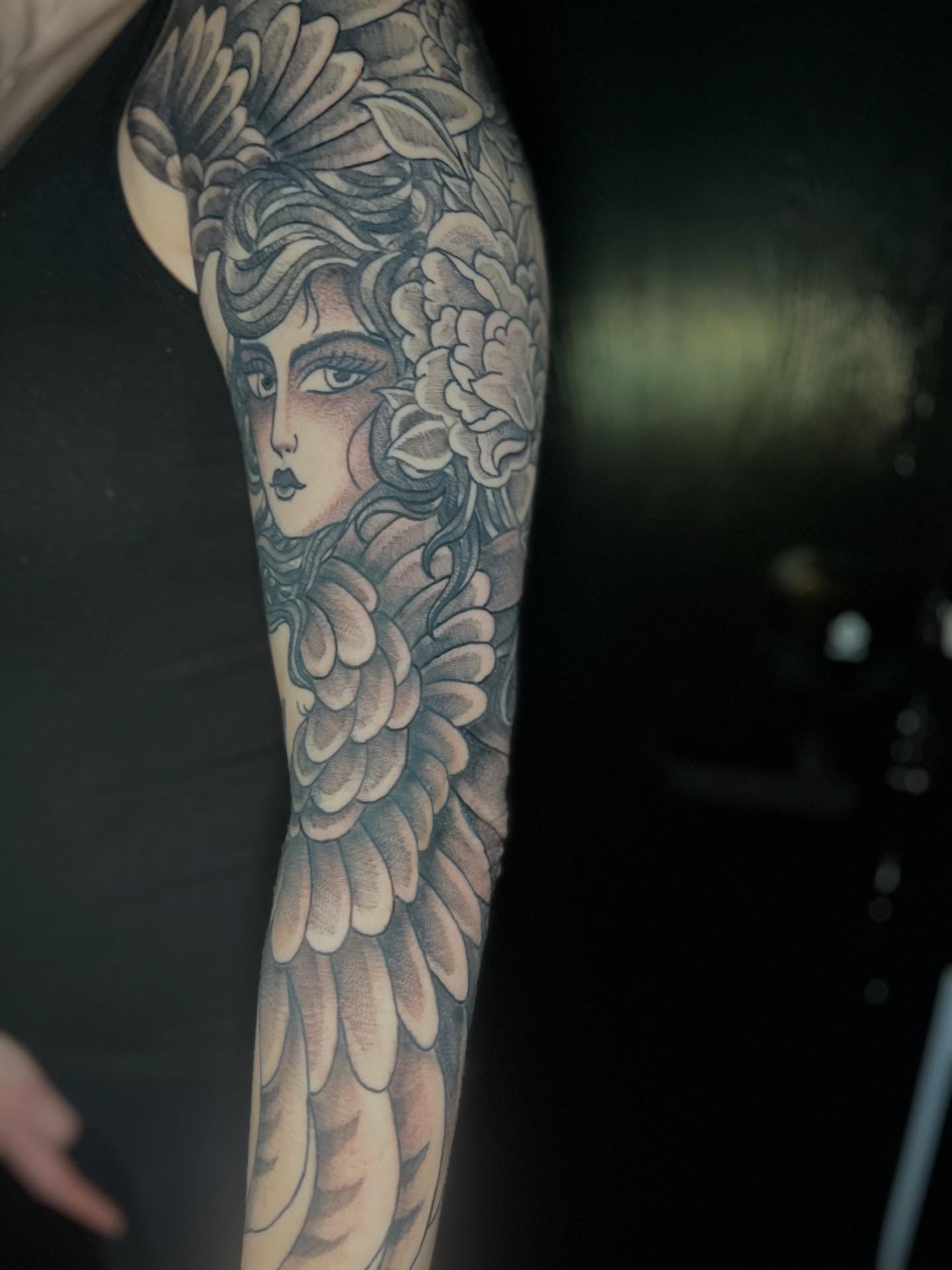 Floral woman realism tattoo on the forearm by CRAIG B⛓️ Cincinnati Tattoo Artist