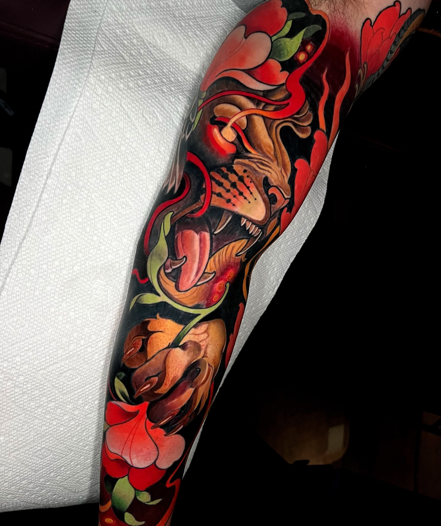 Floral and mask new school tattoo on the forearm by Skyler Miller