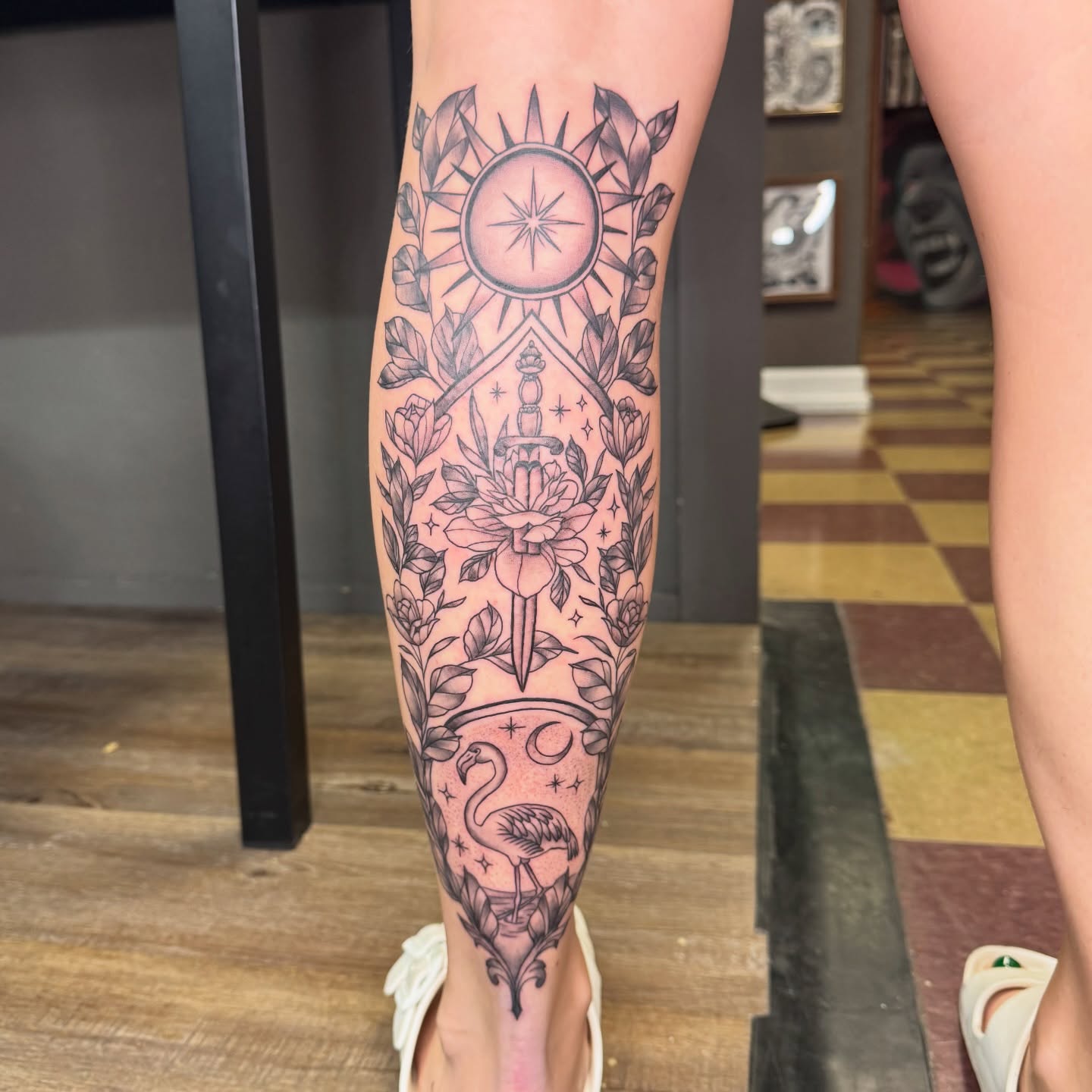 Sun and dagger American traditional tattoo on the calf by Cora Phelps