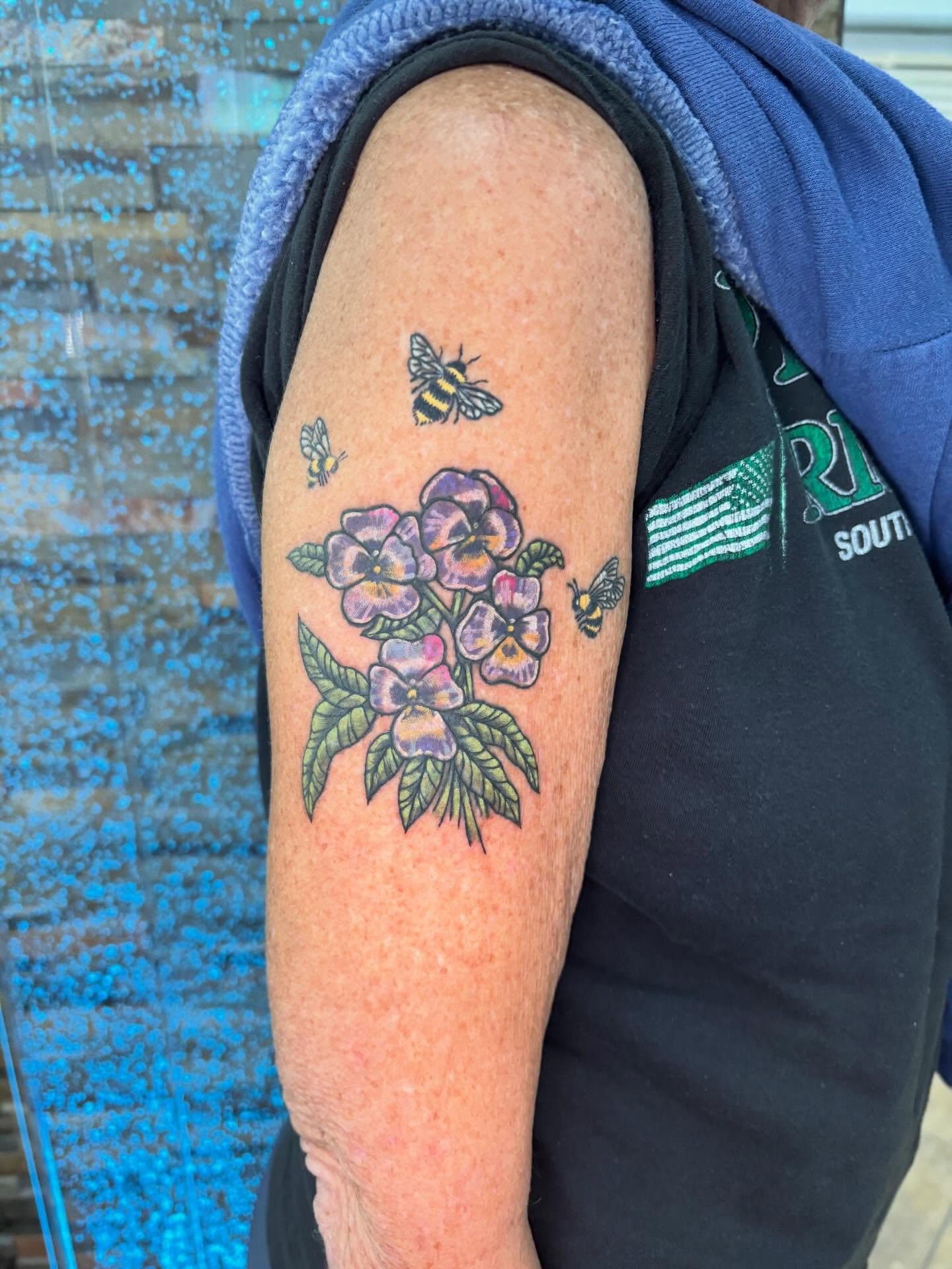 Flowers and bees American traditional tattoo on the forearm by Stephanie Rowe