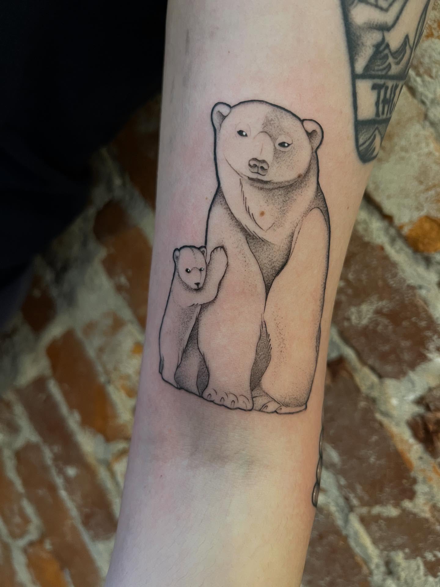 Polar bear and cub dotwork tattoo on the forearm by High Vibrations
