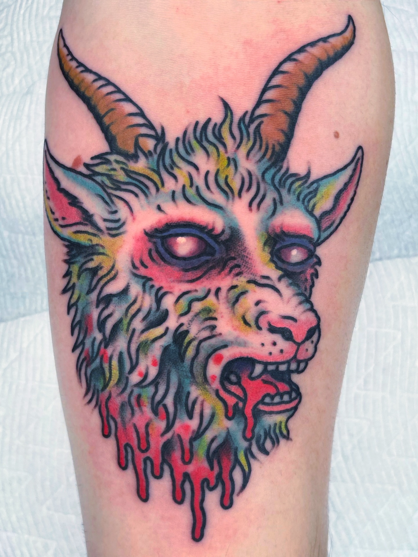 Goat head American traditional tattoo on the thigh by Randy Conner, Portland, Oregon