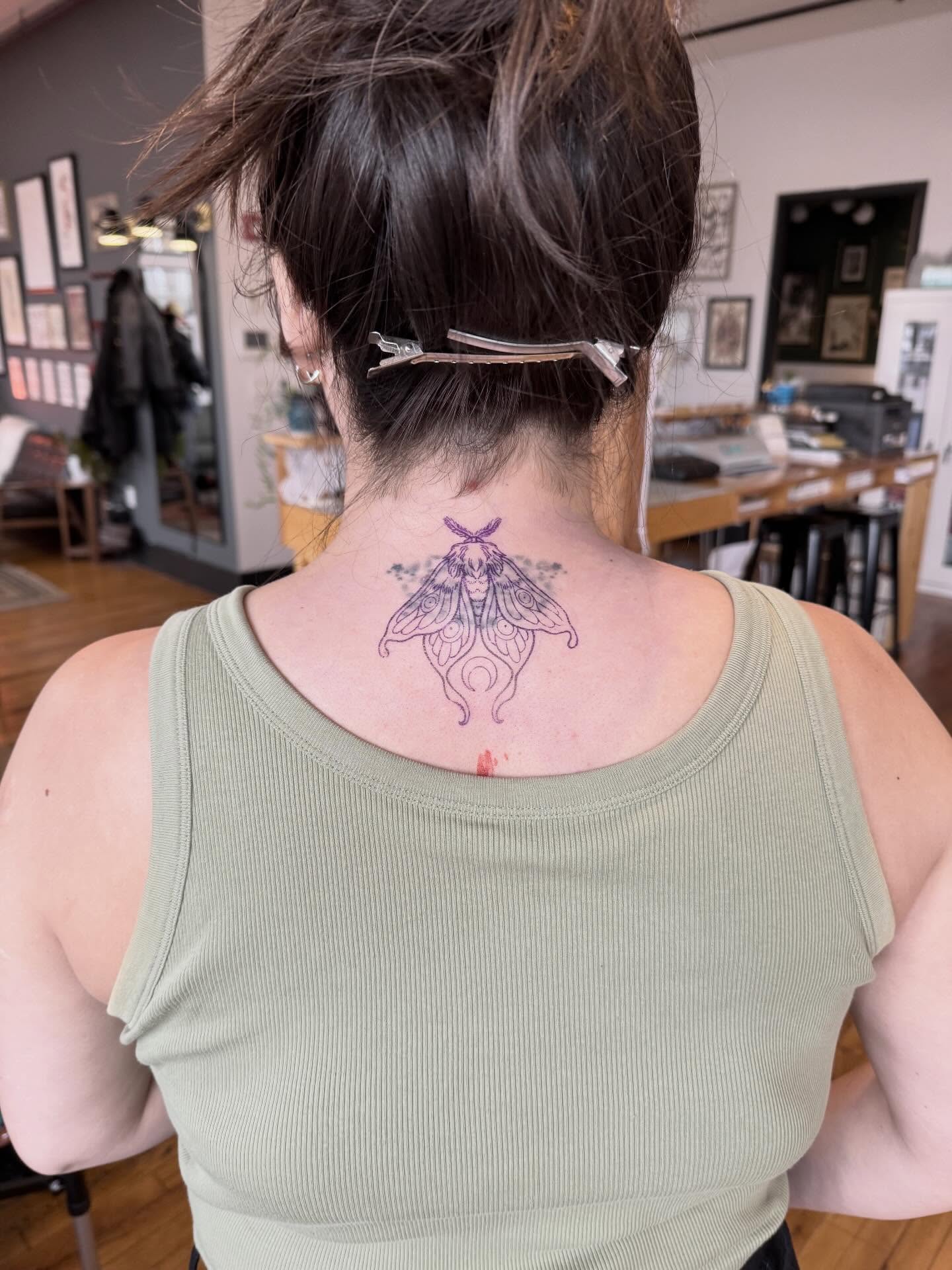 Moth geometric tattoo on the back by Hillary