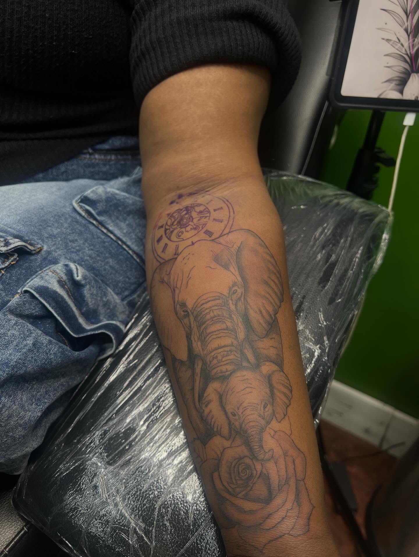 Elephant and baby elephant black and grey tattoo on the forearm by Glass Inkk