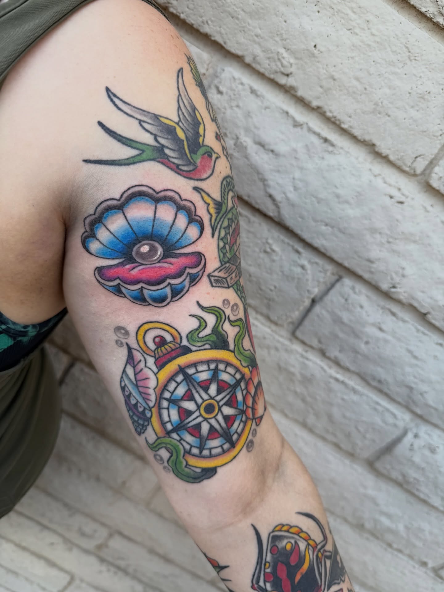Bird, flower, compass American traditional tattoo on the forearm by Kayla Jackson, Phoenix, Arizona