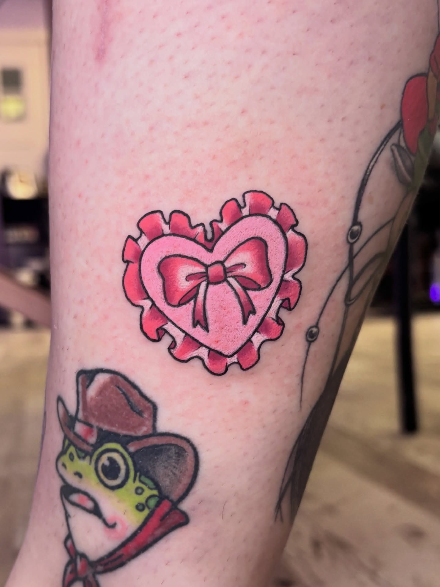 Heart with bow American traditional tattoo on the forearm by 🌸Mandy Blossoms🌸The Cosplaying Tattoo Artist🌸
