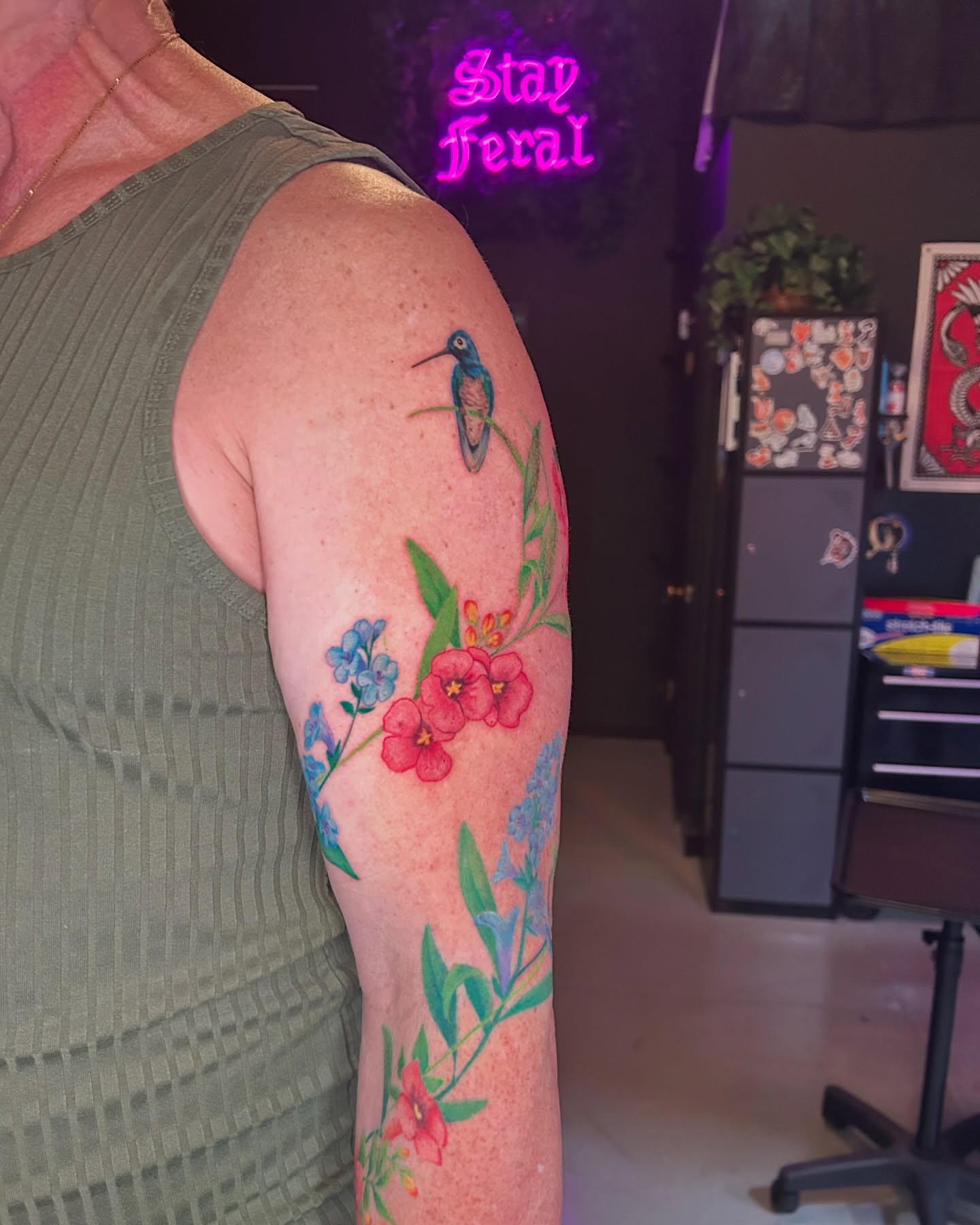 Bird and floral bouquet new school tattoo on the forearm by Mallory