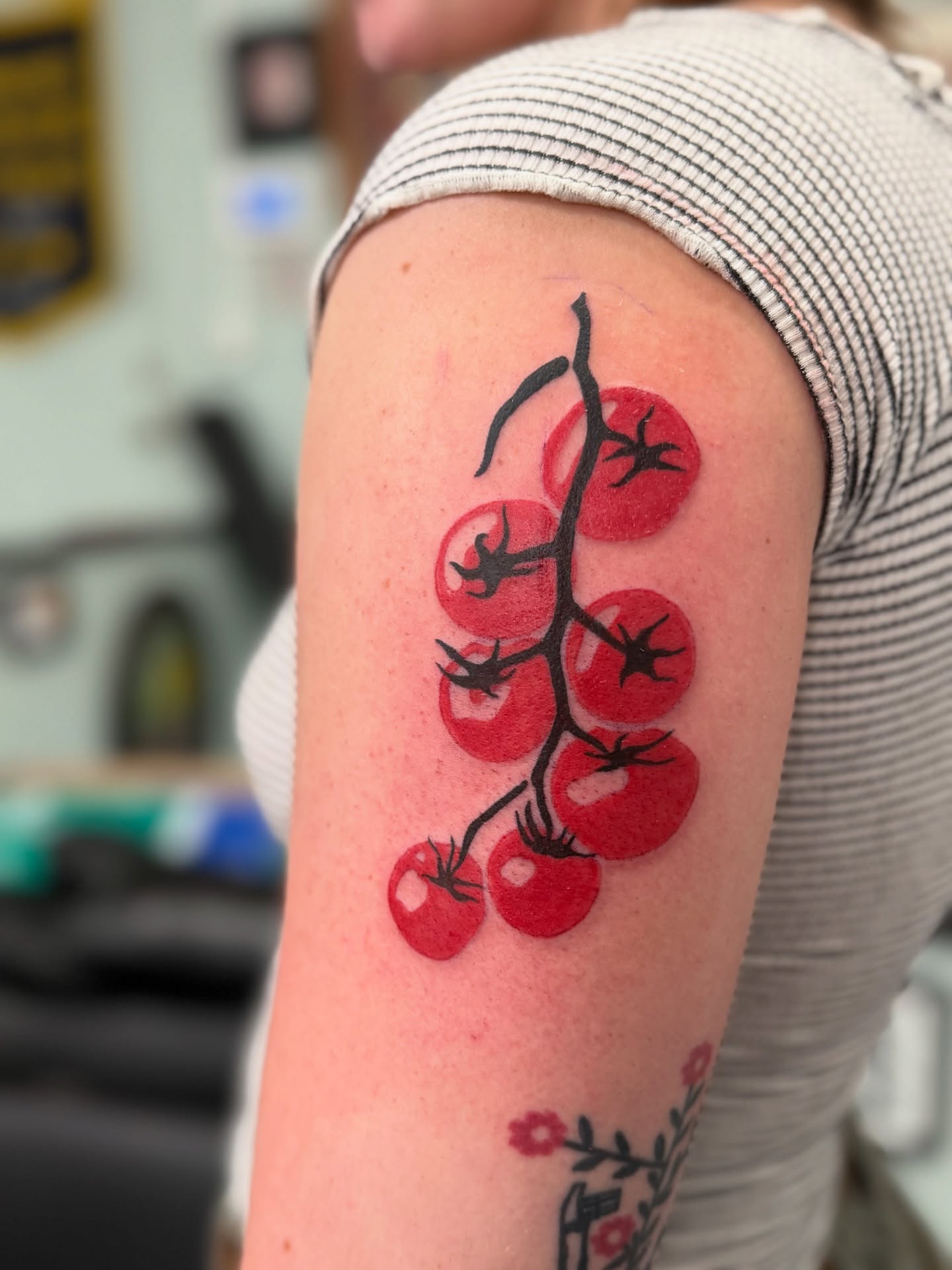 Cherry tomatoes dotwork tattoo on the forearm by Sophie McTear