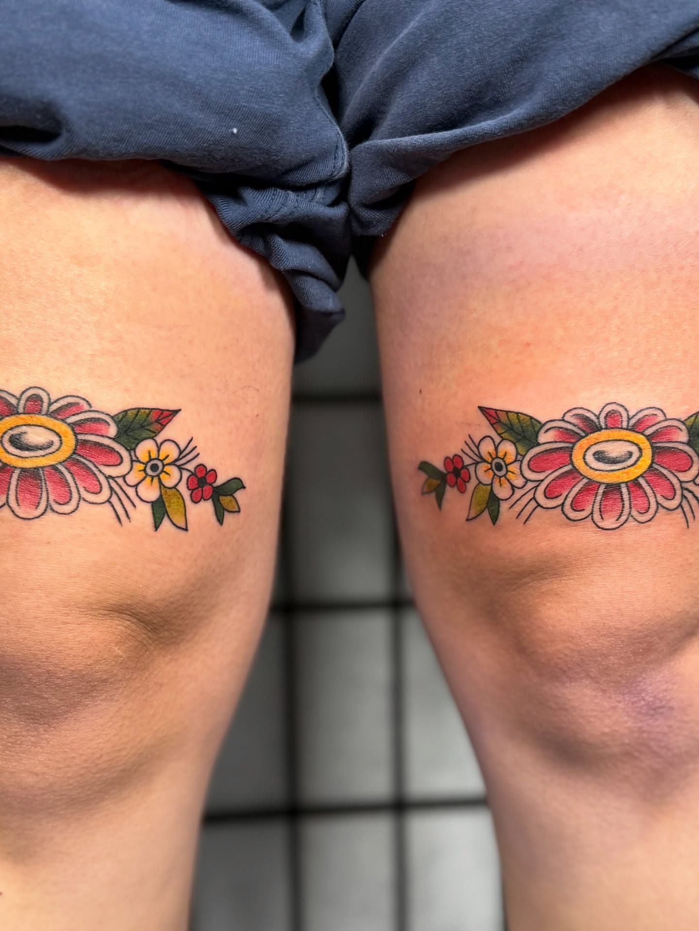 Floral arrangement American traditional tattoo on the thigh by Sophie McTear