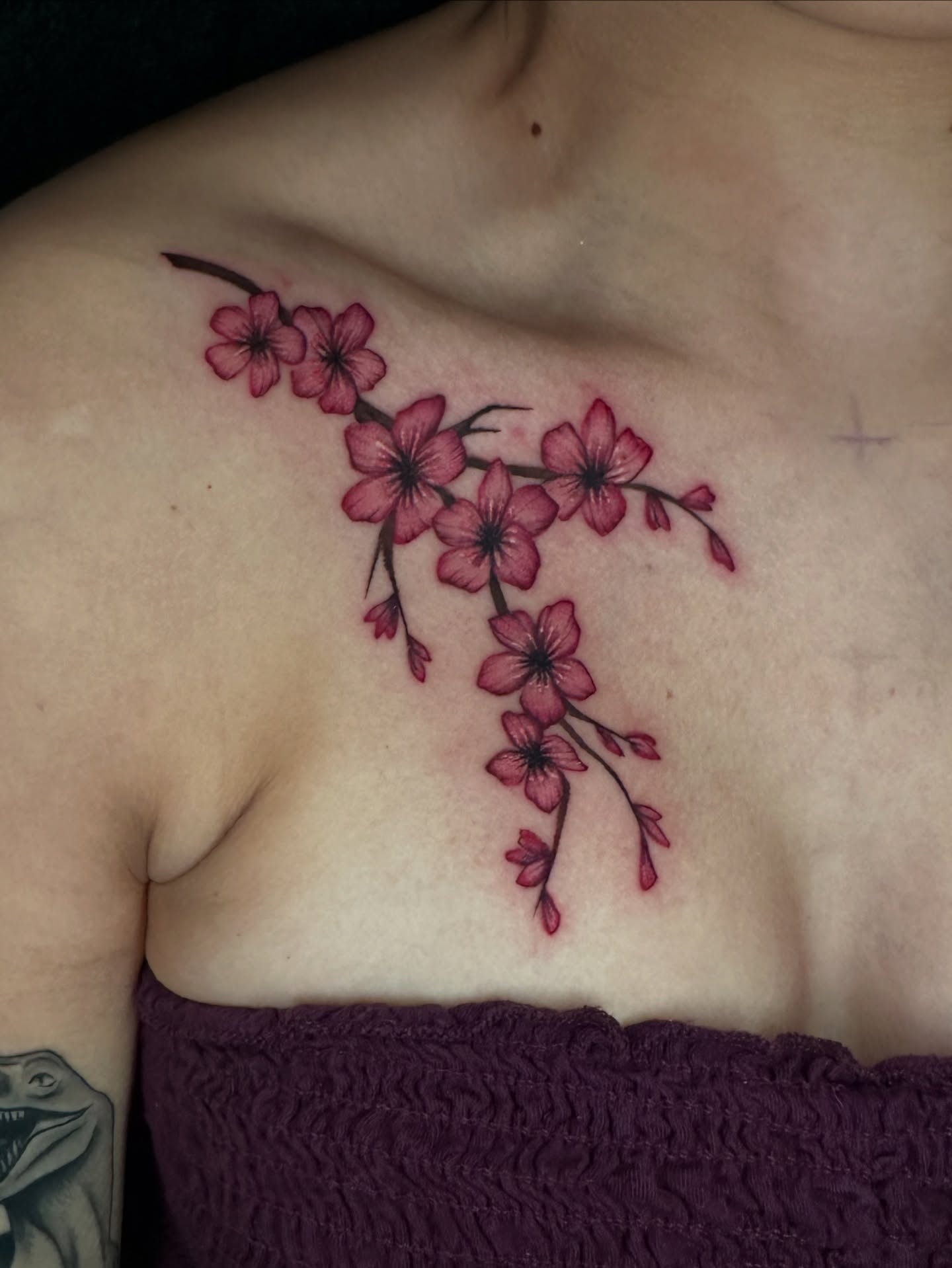 Cherry blossoms dotwork tattoo on the chest by Sam Minneci