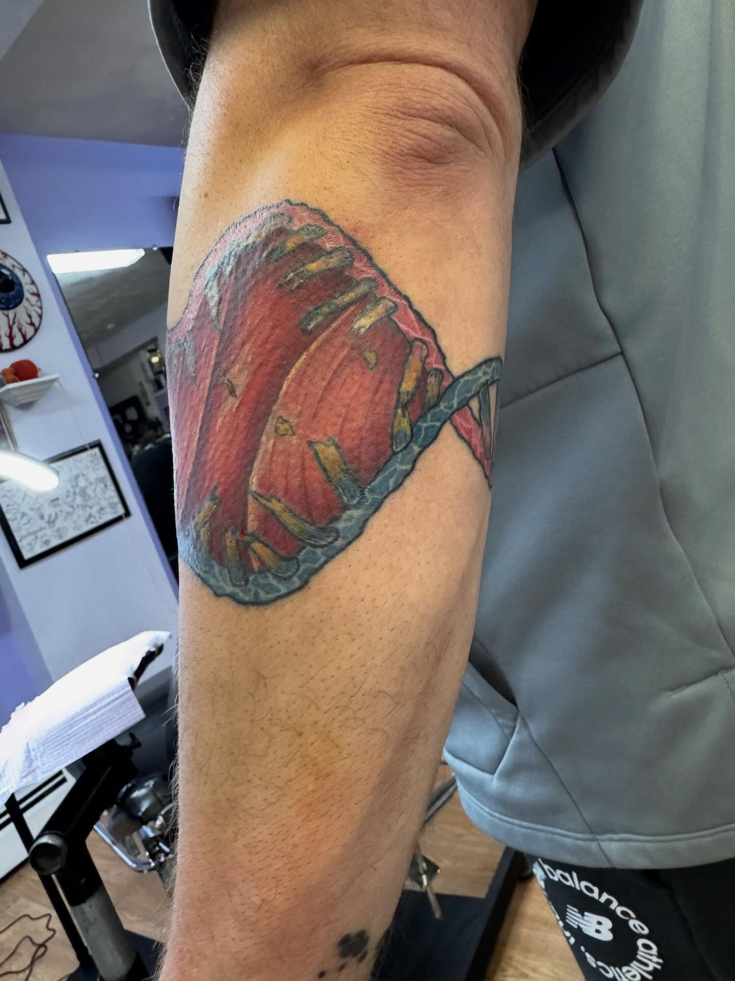 DNA strand realism tattoo on the forearm by Justin Fiveson