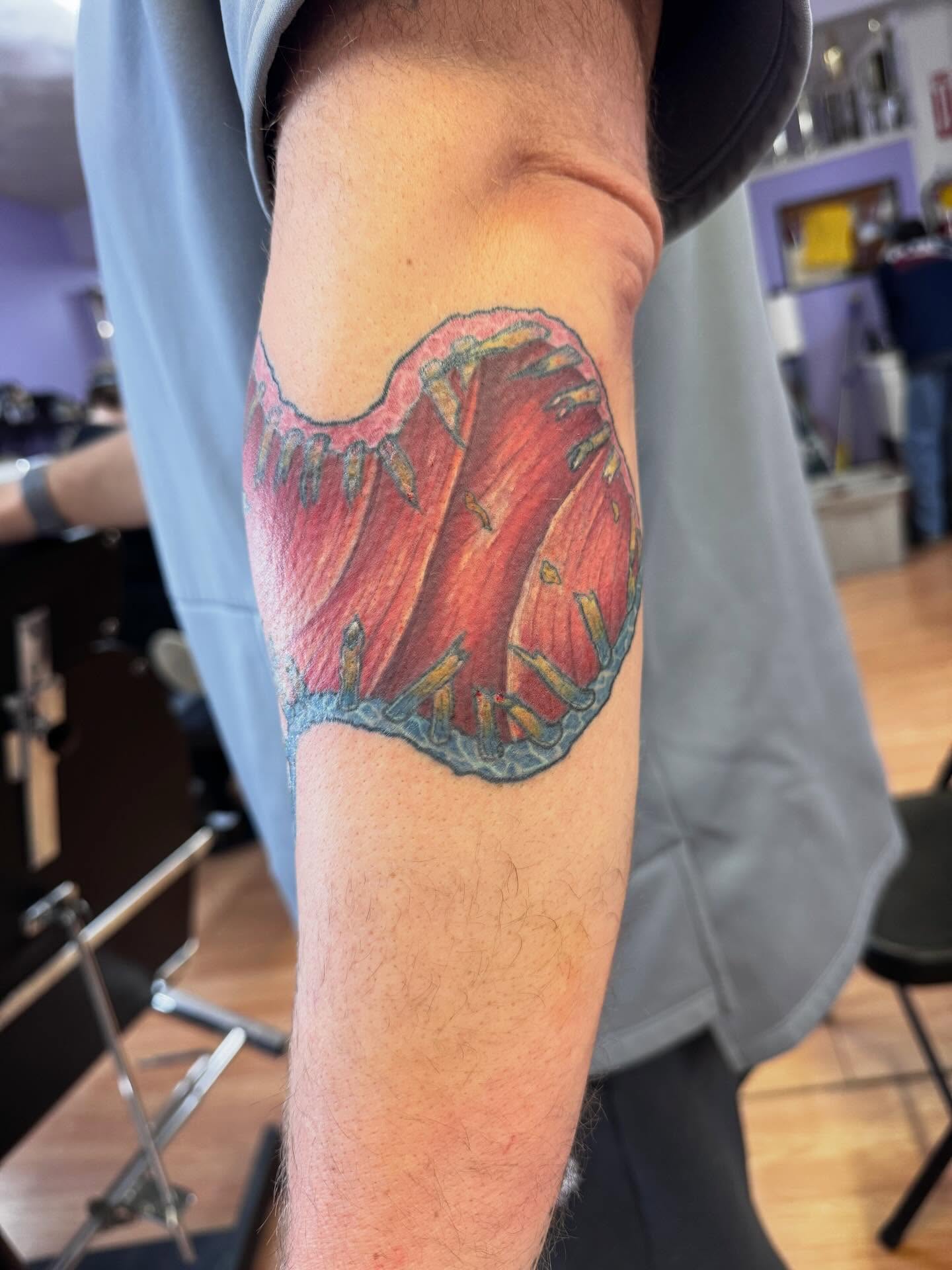 Coral reef realism tattoo on the forearm by Justin Fiveson