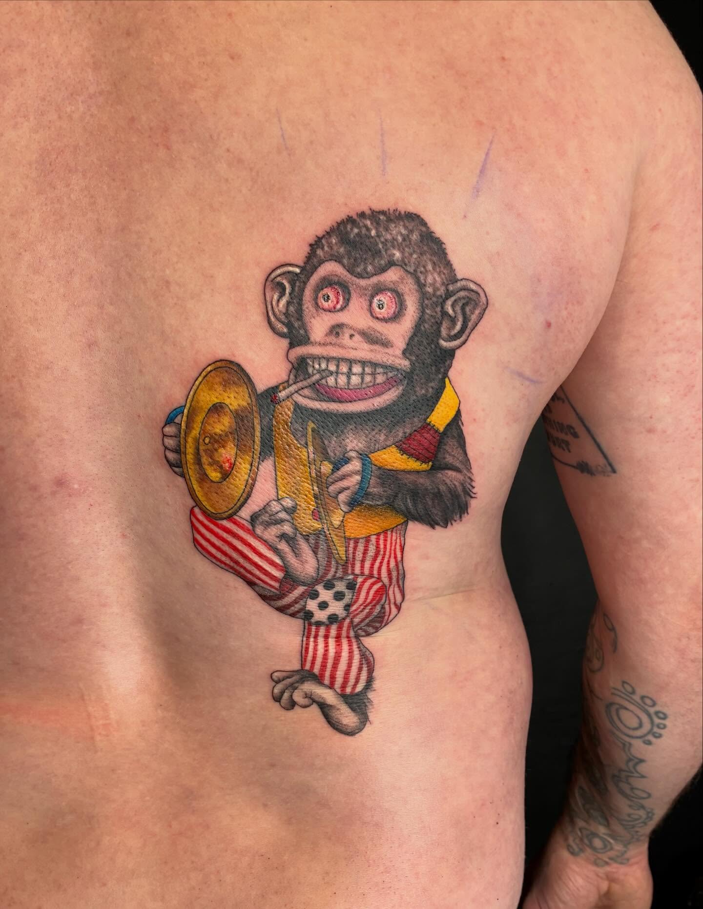 Circus monkey American traditional tattoo on the ribs by Linzi Hungerford, Bozeman, Montana