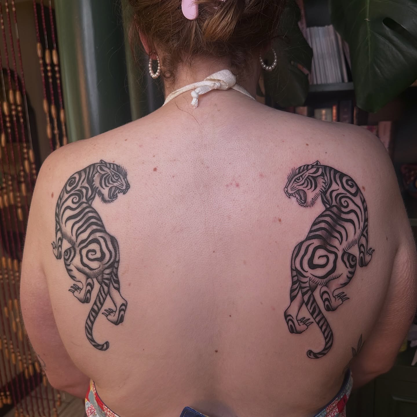 Tigers black and grey tattoo on the back by Brieana Smith
