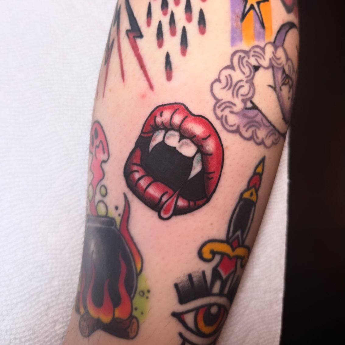 Lips American traditional tattoo on the forearm by Shelby
