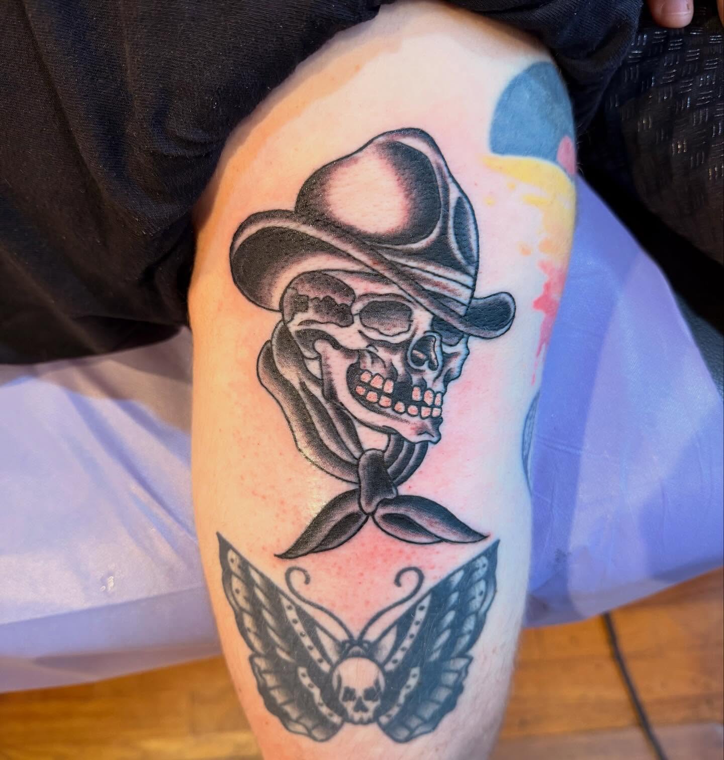 Cowboy skull American traditional tattoo on the thigh by Mike Kepper