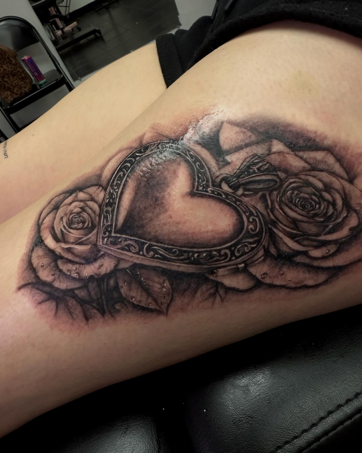 Heart and roses realism tattoo on the forearm by Rachel