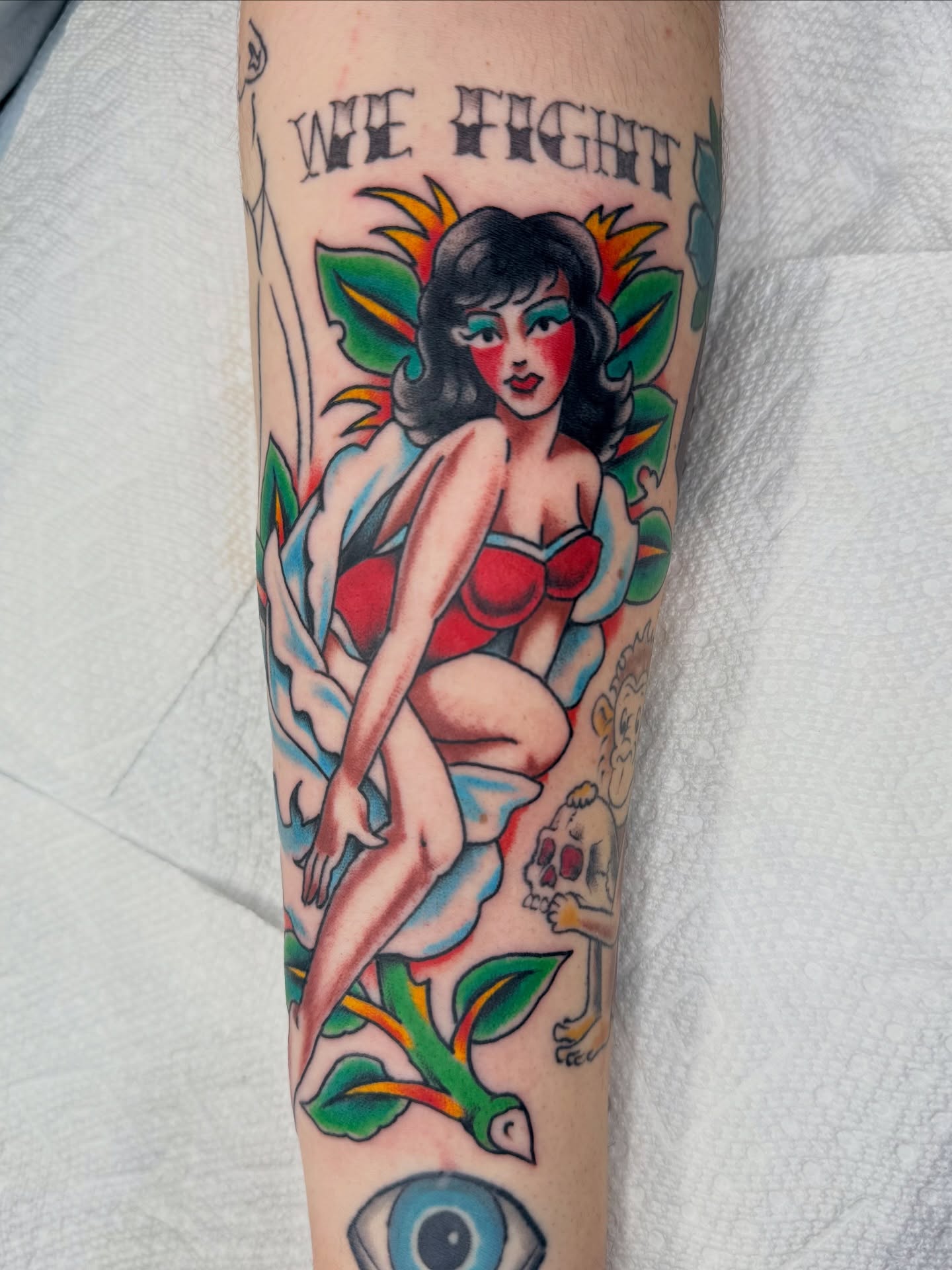 Pin-up girl American traditional tattoo on the forearm by Zak Colburn