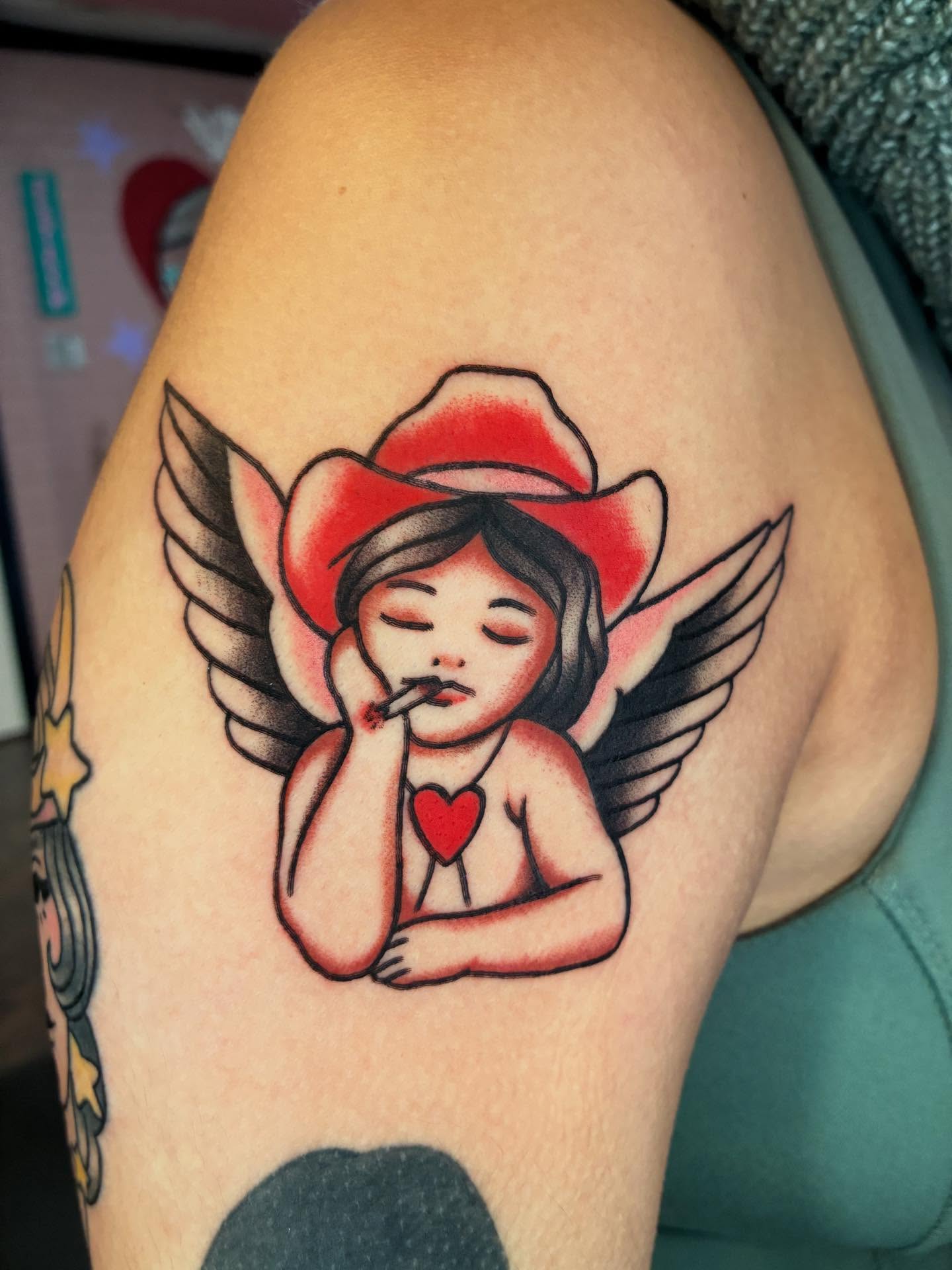 Angel smoking American traditional tattoo on the shoulder by ๐๐ช๐๐ซ๐ก๐ ๐๐ฏ๐ถ๐ฉ๐