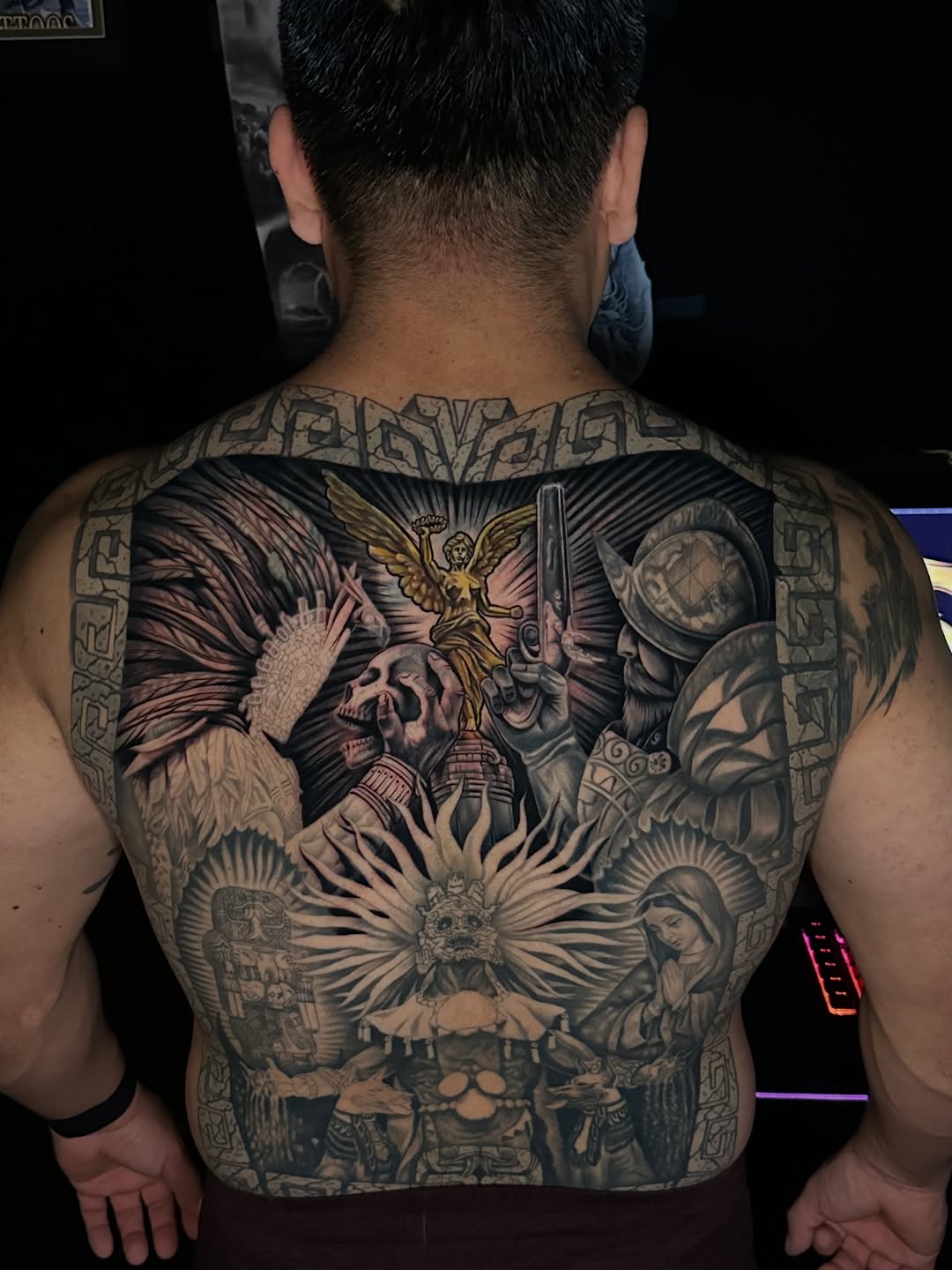 Aztec mythology and conquest realism tattoo on the back by Omar Sheriff Herrera
