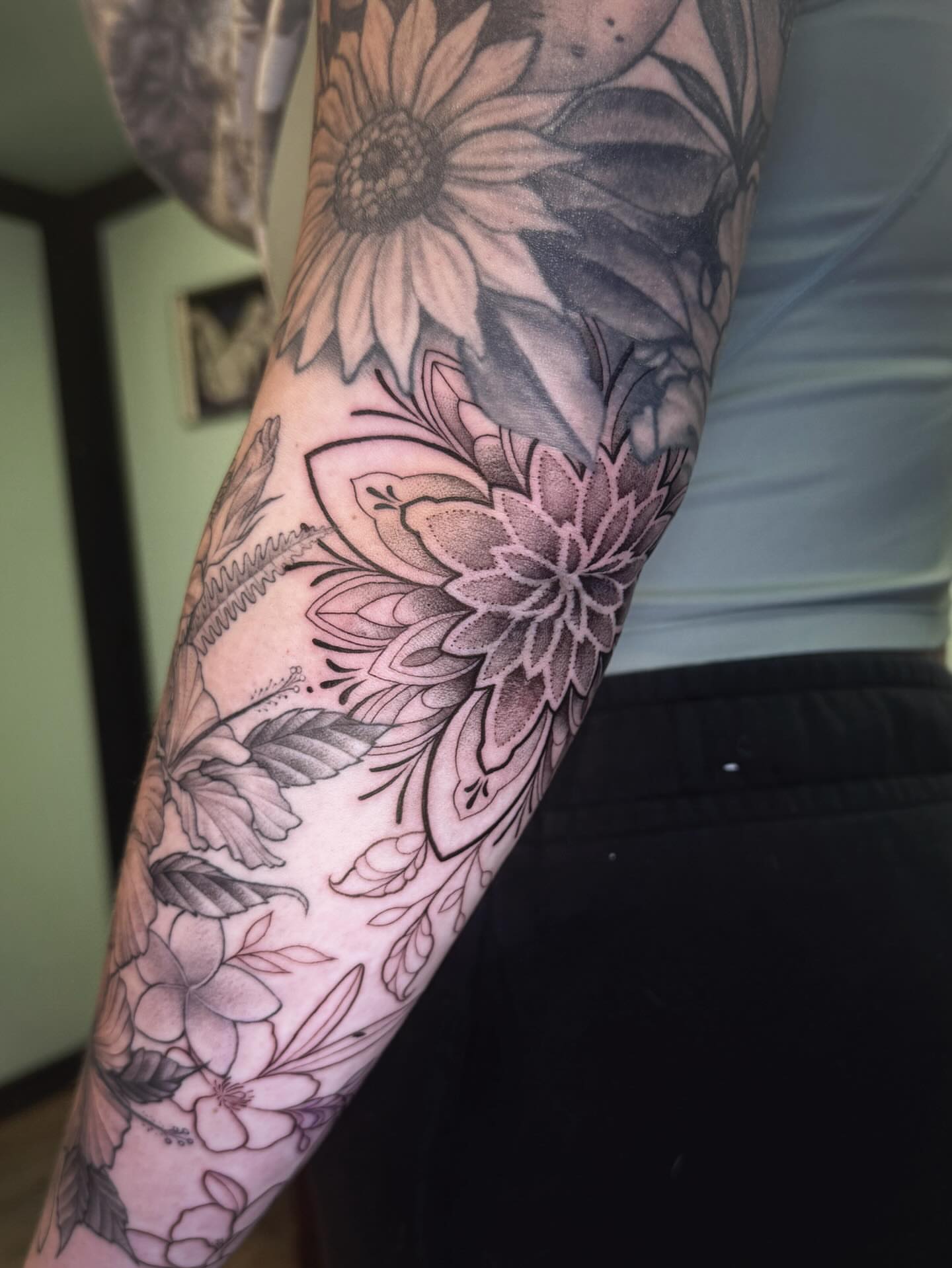 Floral arrangement dotwork tattoo on the forearm by Audrey