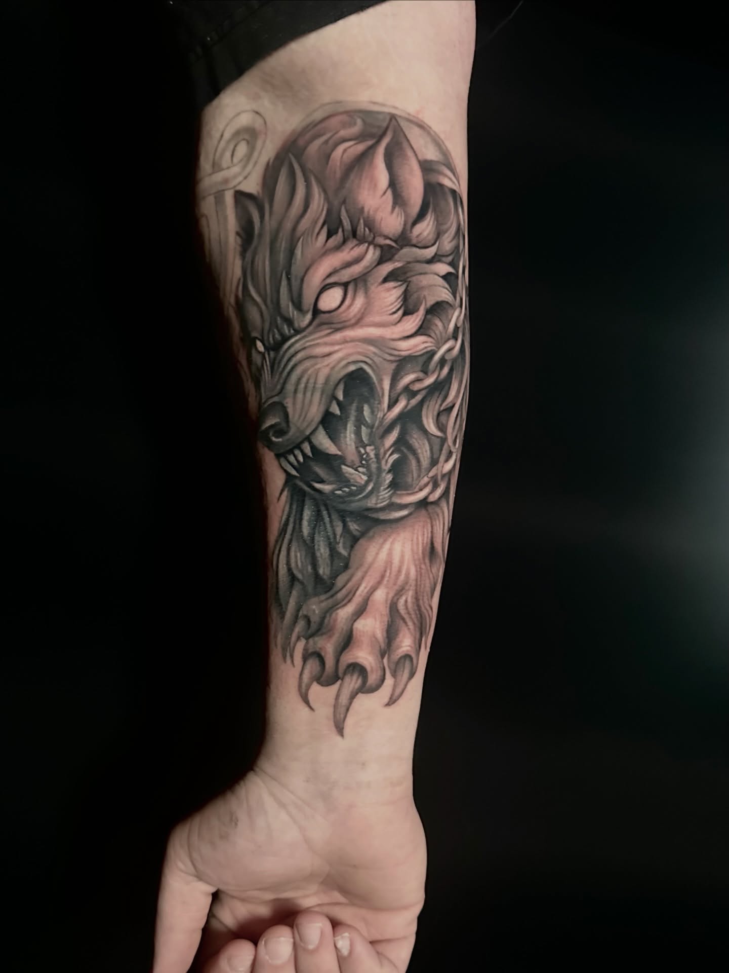Wolf dark realism tattoo on the forearm by Tyler Reep