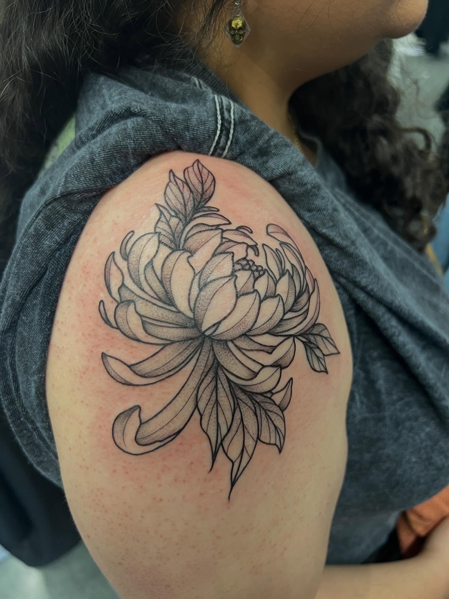 Chrysanthemum black and grey tattoo on the shoulder by Baung Ben