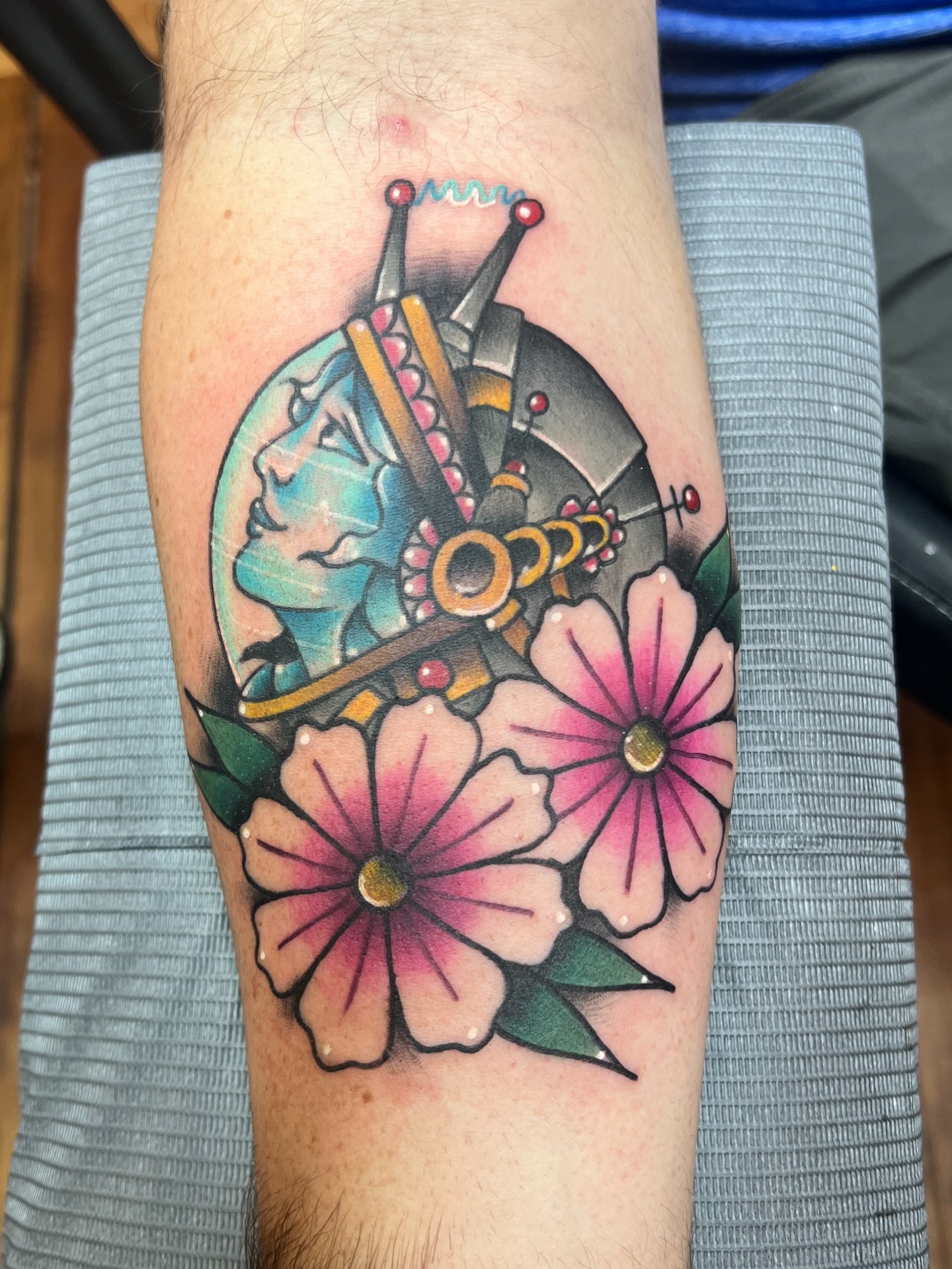 Floral crown American traditional tattoo on the forearm by Fizzy Jizzles, Worcester, England