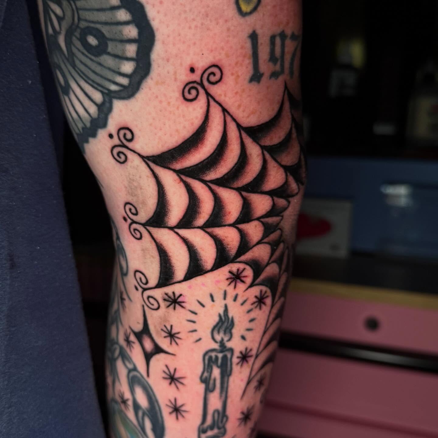 Ship and candle American traditional tattoo on the forearm by Mallory Brown