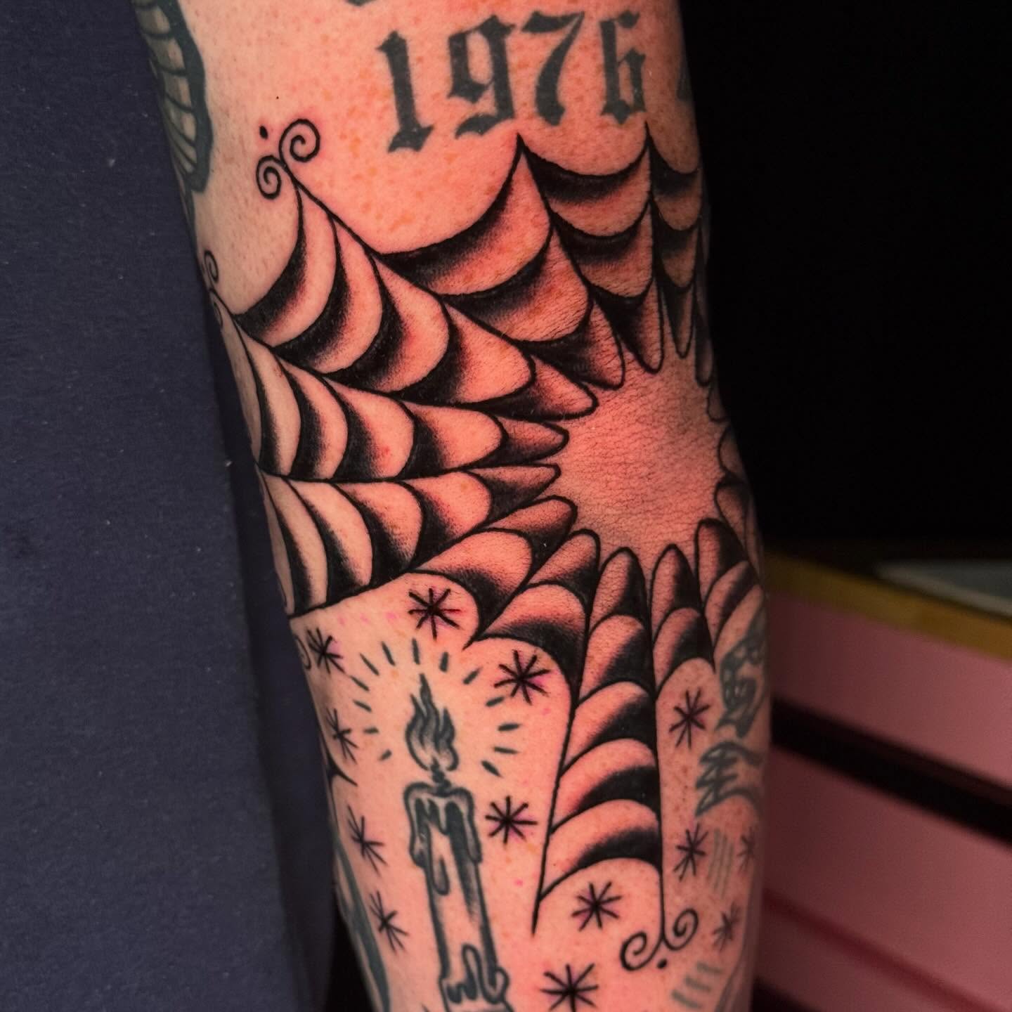 Winged candle American traditional tattoo on the forearm by Mallory Brown