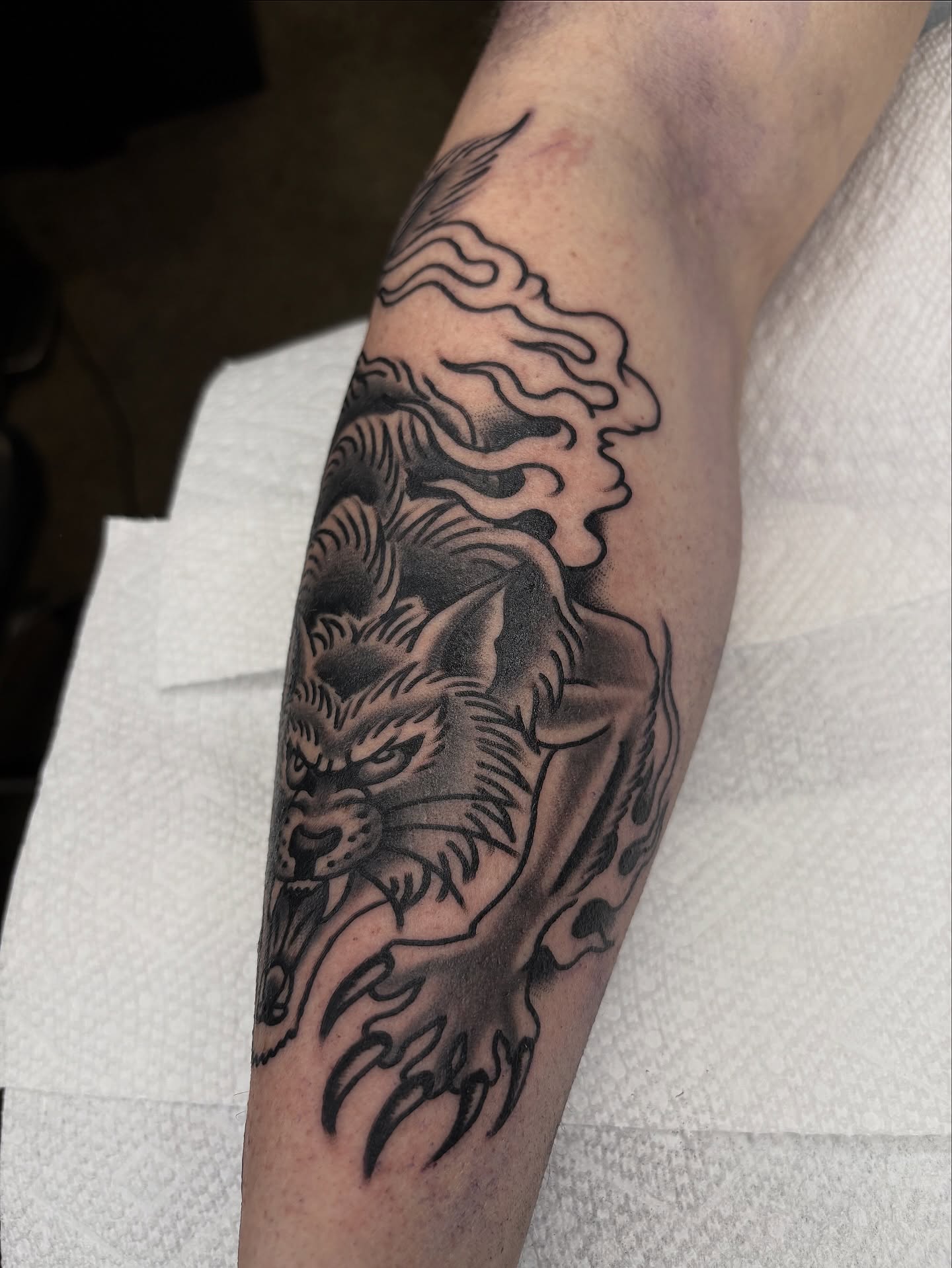 Wolf black and grey tattoo on the forearm by Dallas Tattoo Artist
