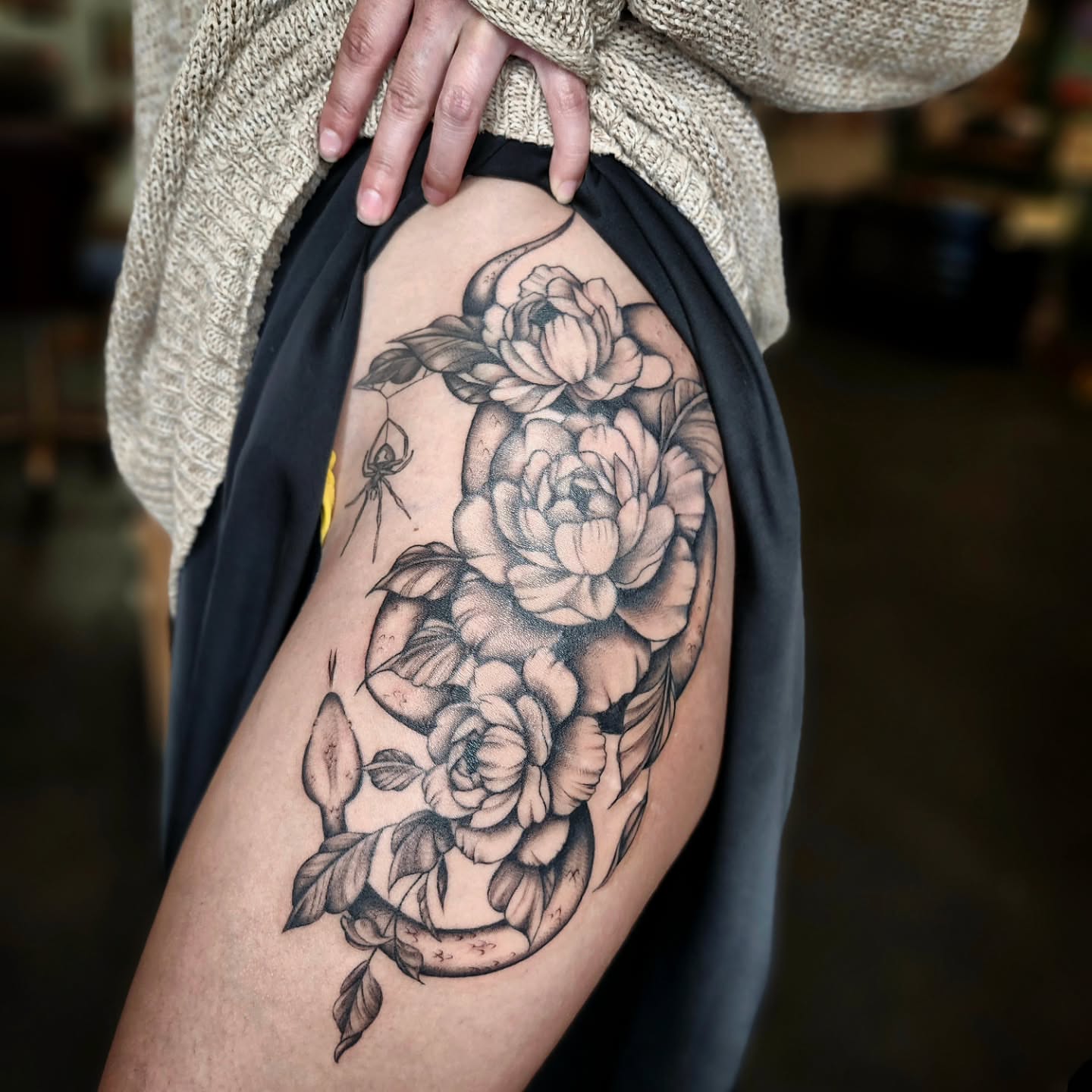 Peonies black and grey tattoo on the thigh by Kelly Zito