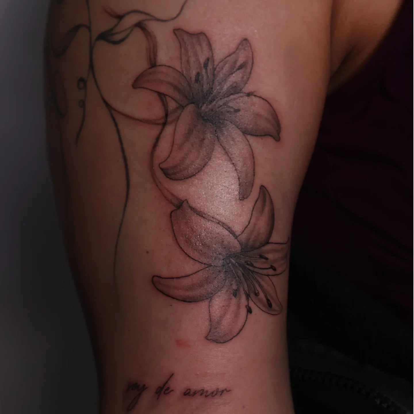 Lily flowers black and grey tattoo on the forearm by Joc