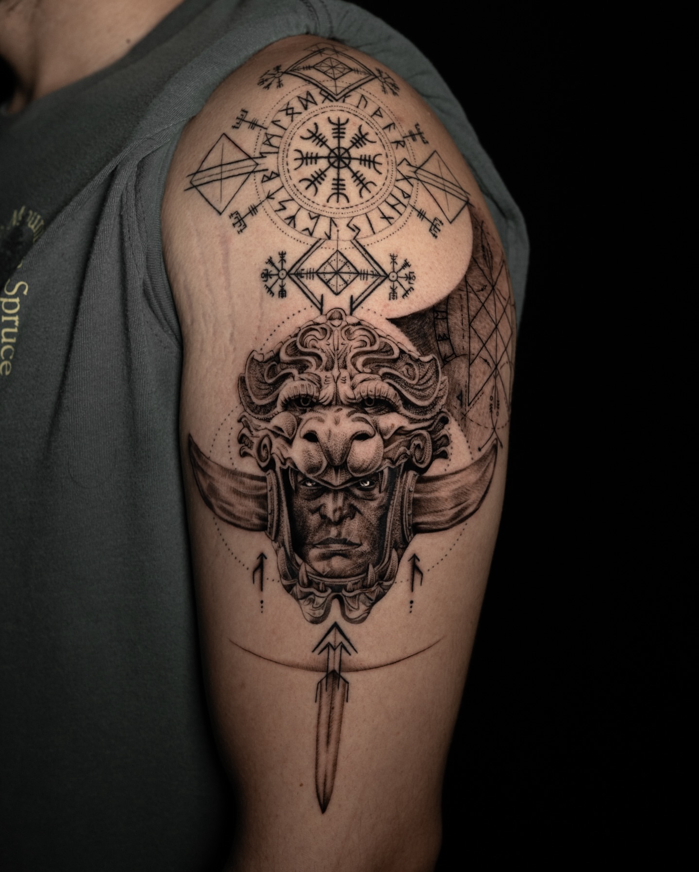 Viking warrior helmet geometric tattoo on the shoulder by Tattoo Artist