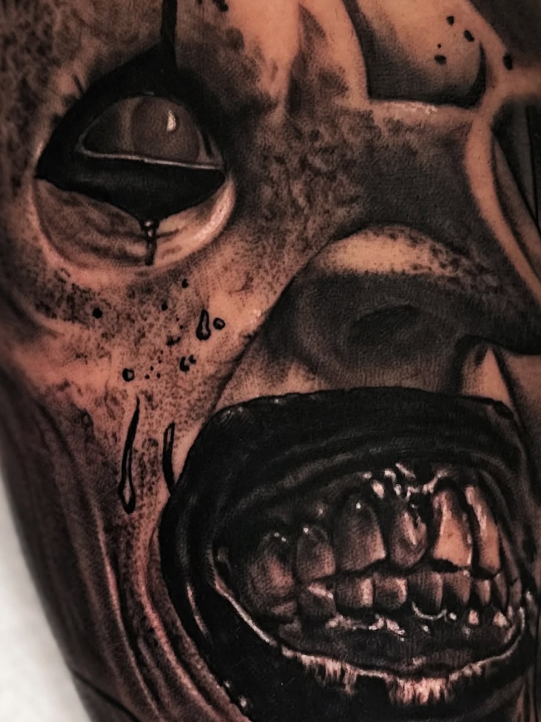Creepy clown face realism tattoo by Jesse White, Mentor, Ohio