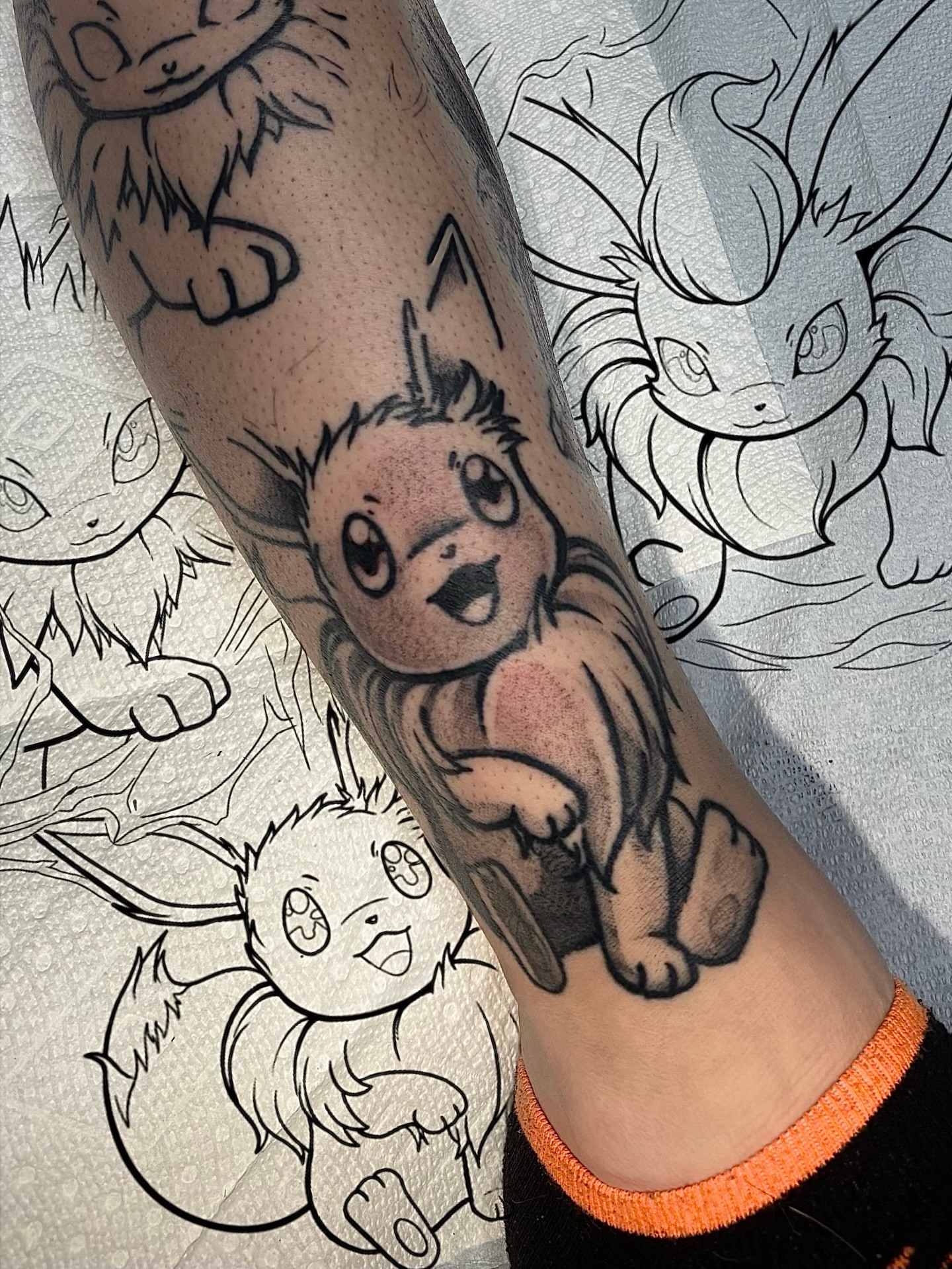 Eevee black and grey tattoo on the forearm by aleah 🌙