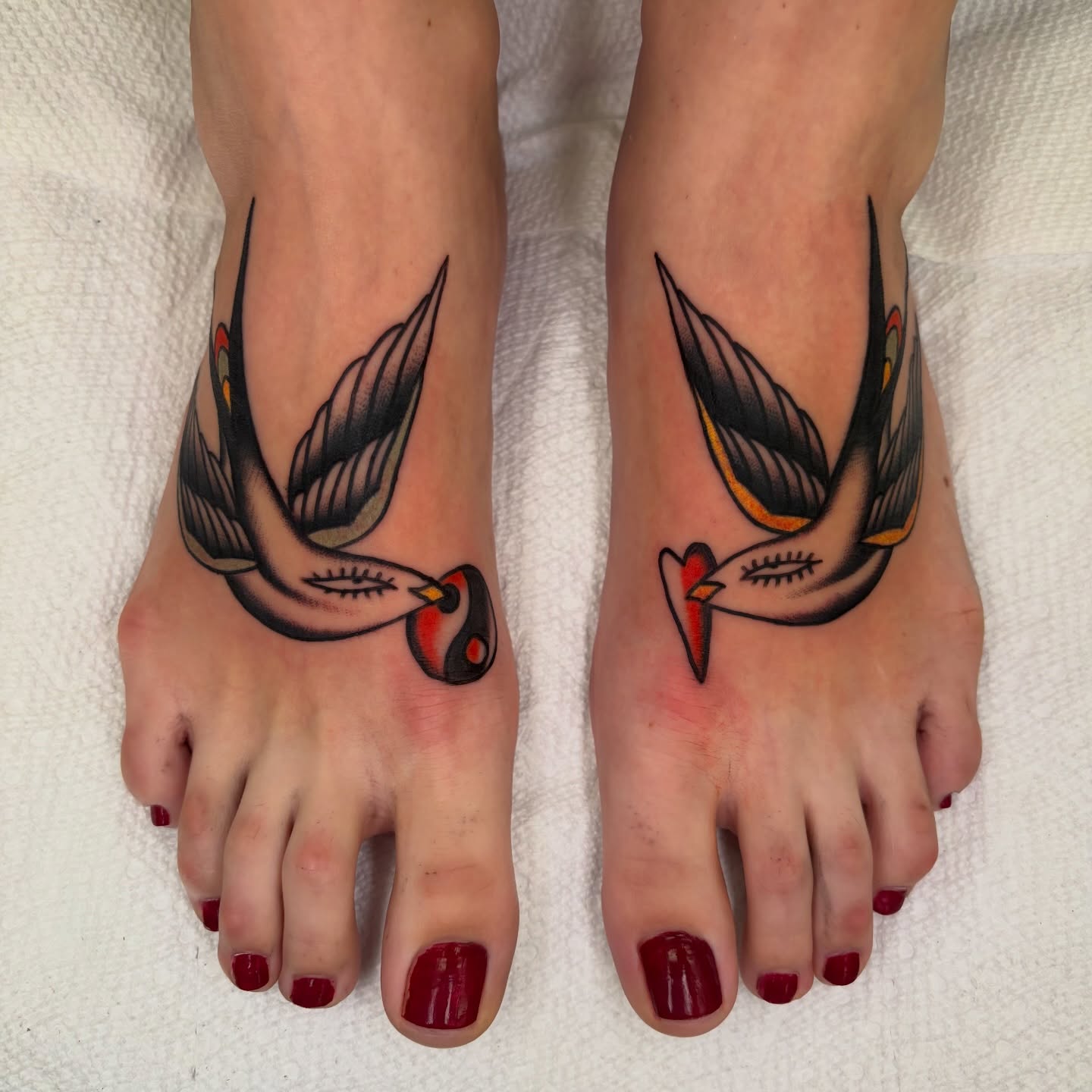 Swallow American traditional tattoo on the foot by rachael