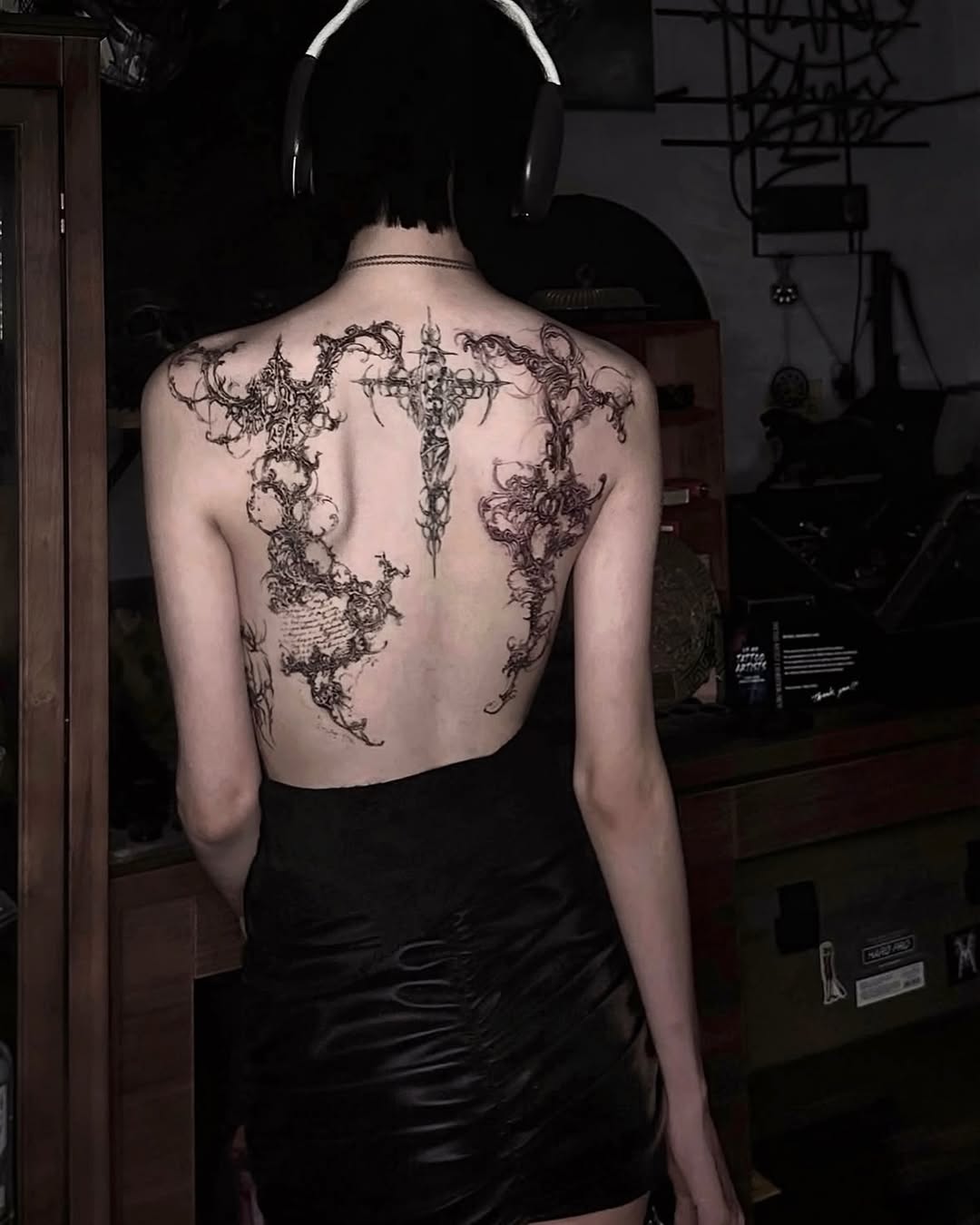 Ornamental cross and abstract patterns cyber sigilism tattoo on the back by @ashencoil