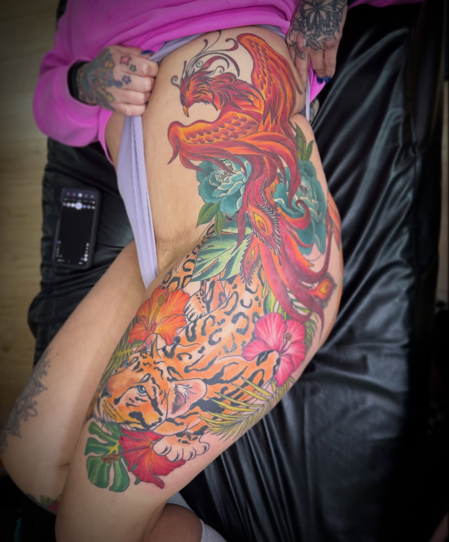 Phoenix and leopard new school tattoo on the thigh by Dani Fried Tattoos