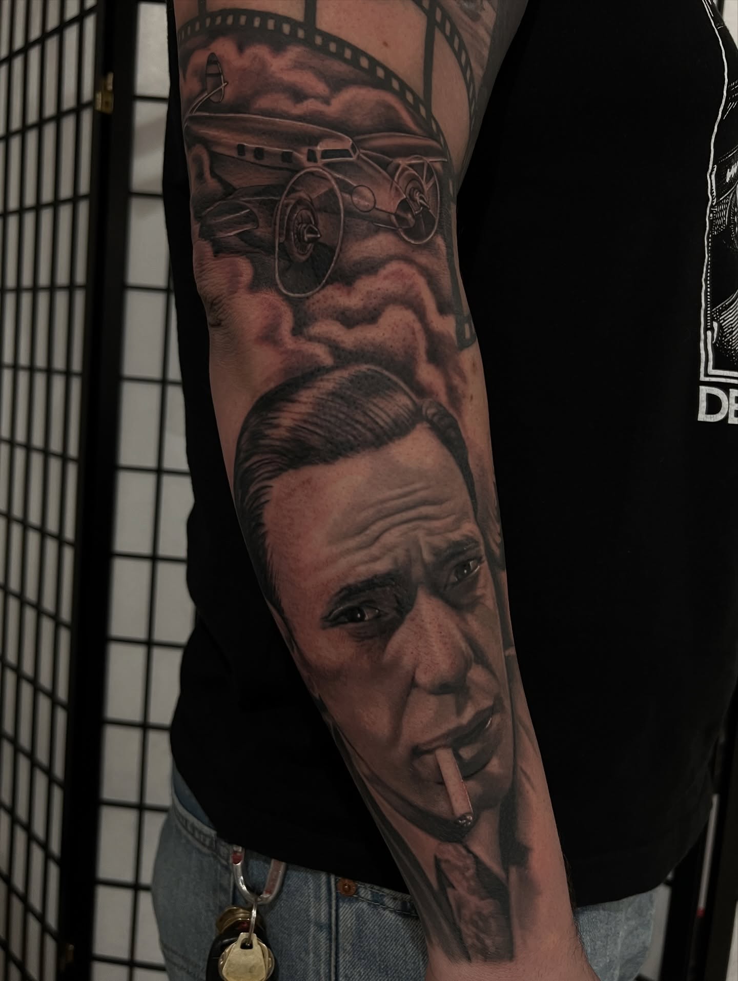 Man smoking realism tattoo on the forearm by Nick Bridwell, Downey, California