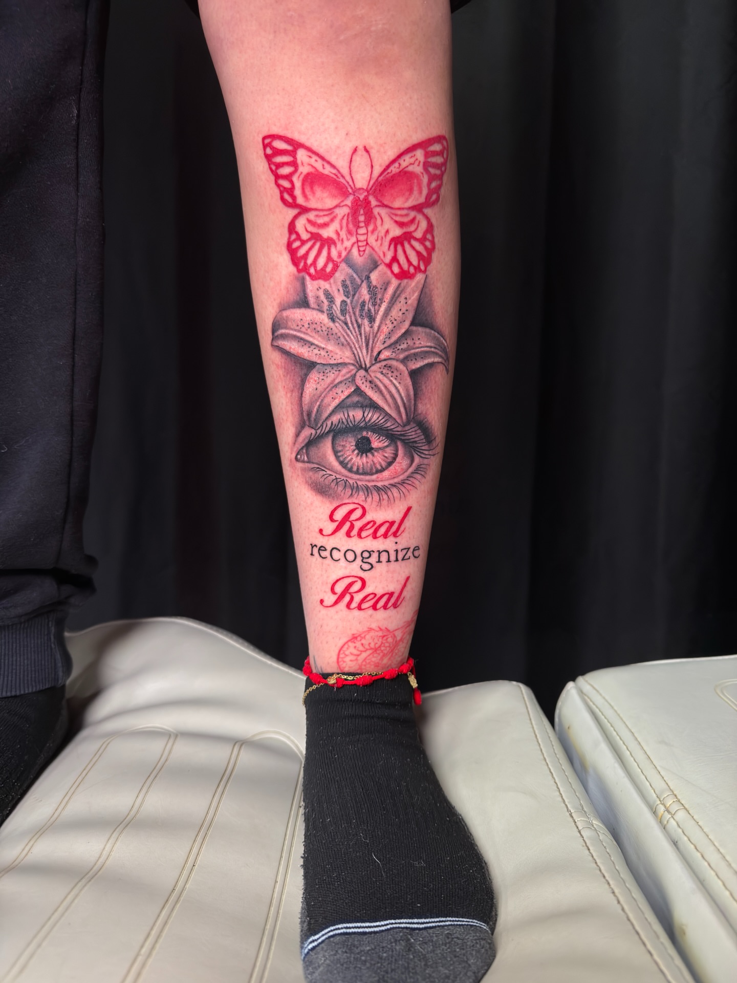 Butterfly, lily, eye realism tattoo on the forearm by InkbyEase, Wayne, New Jersey
