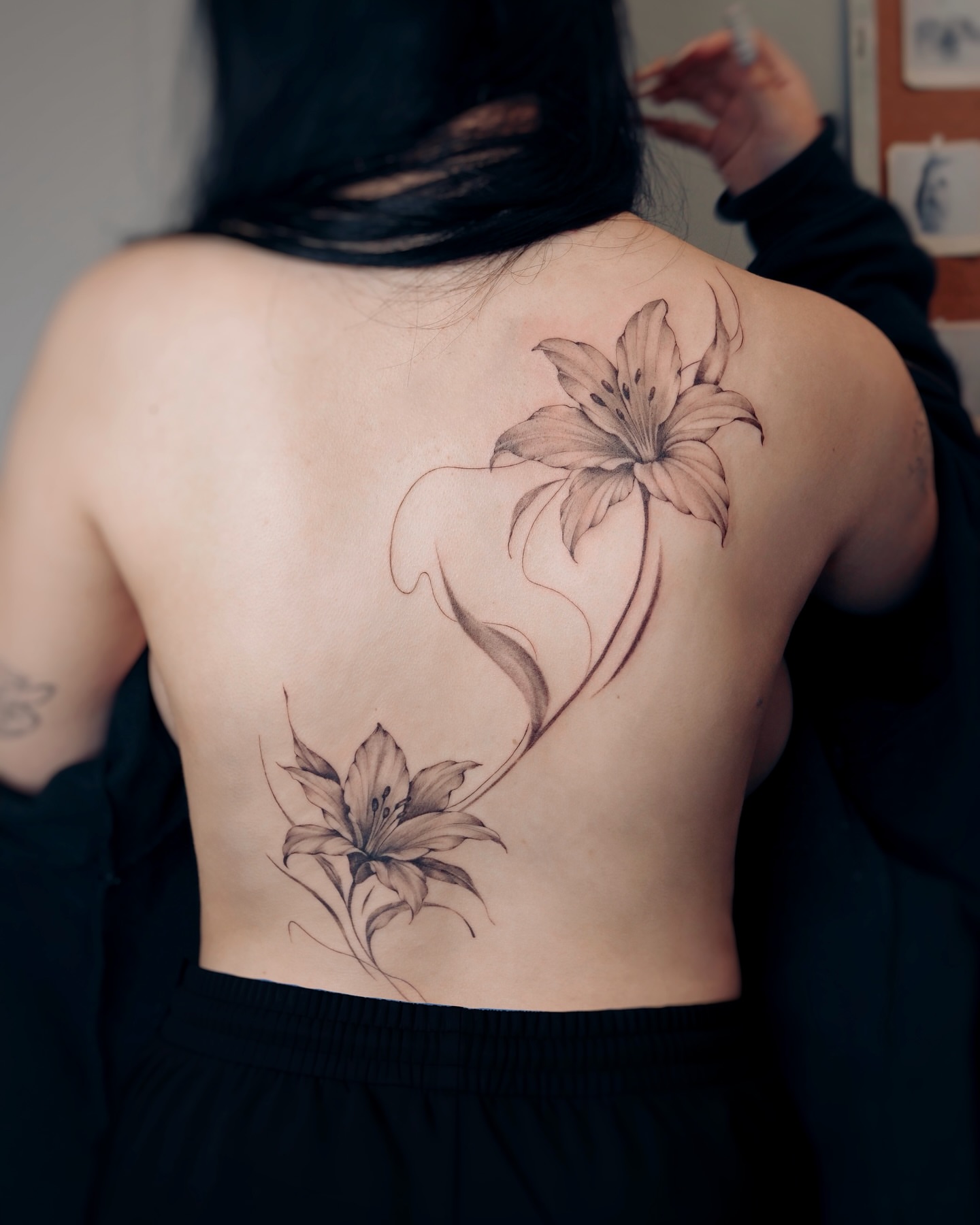 Lily flowers black and grey tattoo on the back by Alina 🌙 Tattoo in Calgary 🇨🇦