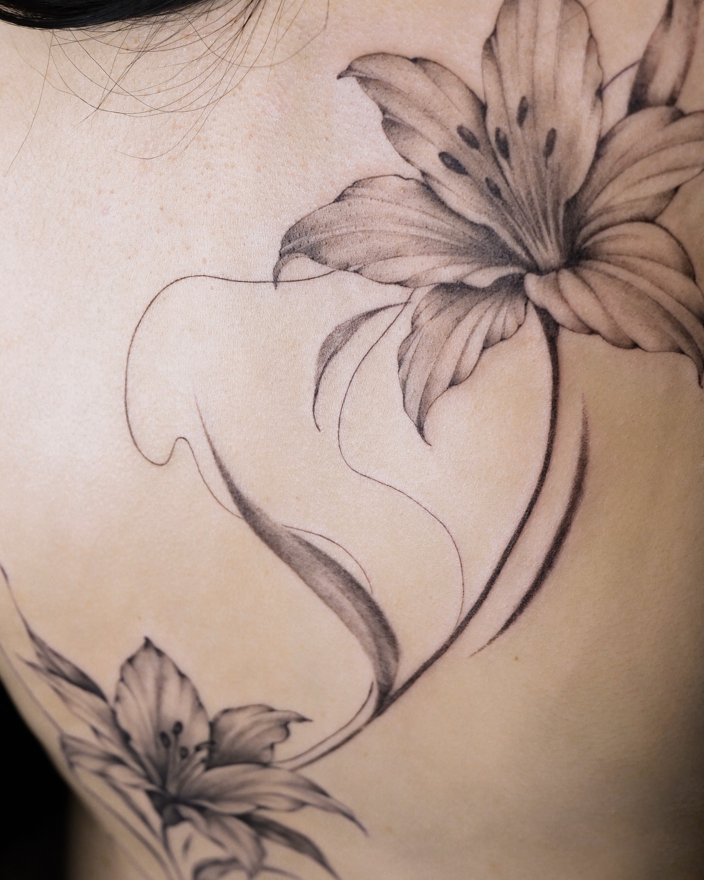Lily flowers realism tattoo on the shoulder by Alina 🌙 Tattoo in Calgary 🇨🇦