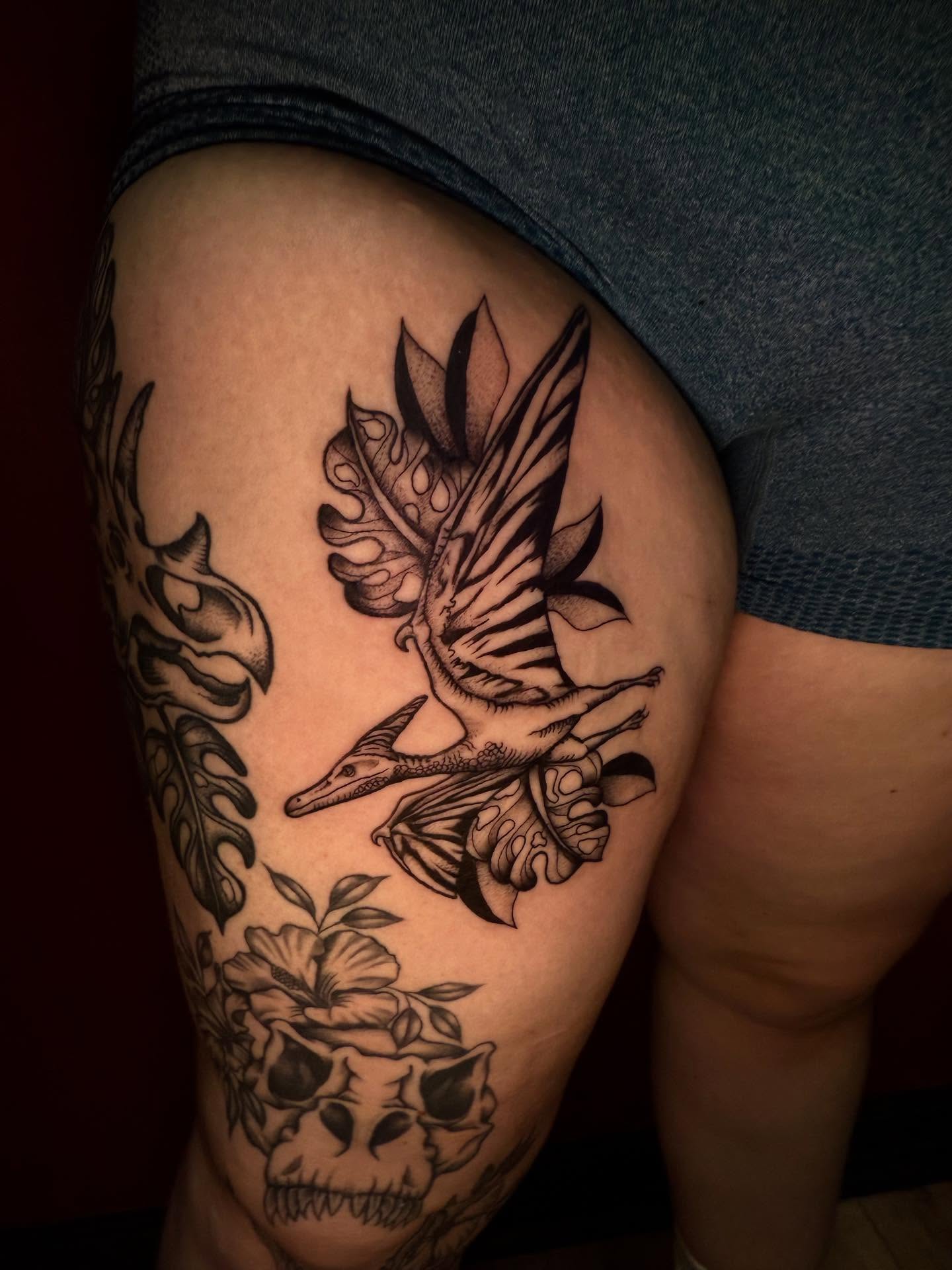 Bird and skull geometric tattoo on the thigh by Penny - Tattooer