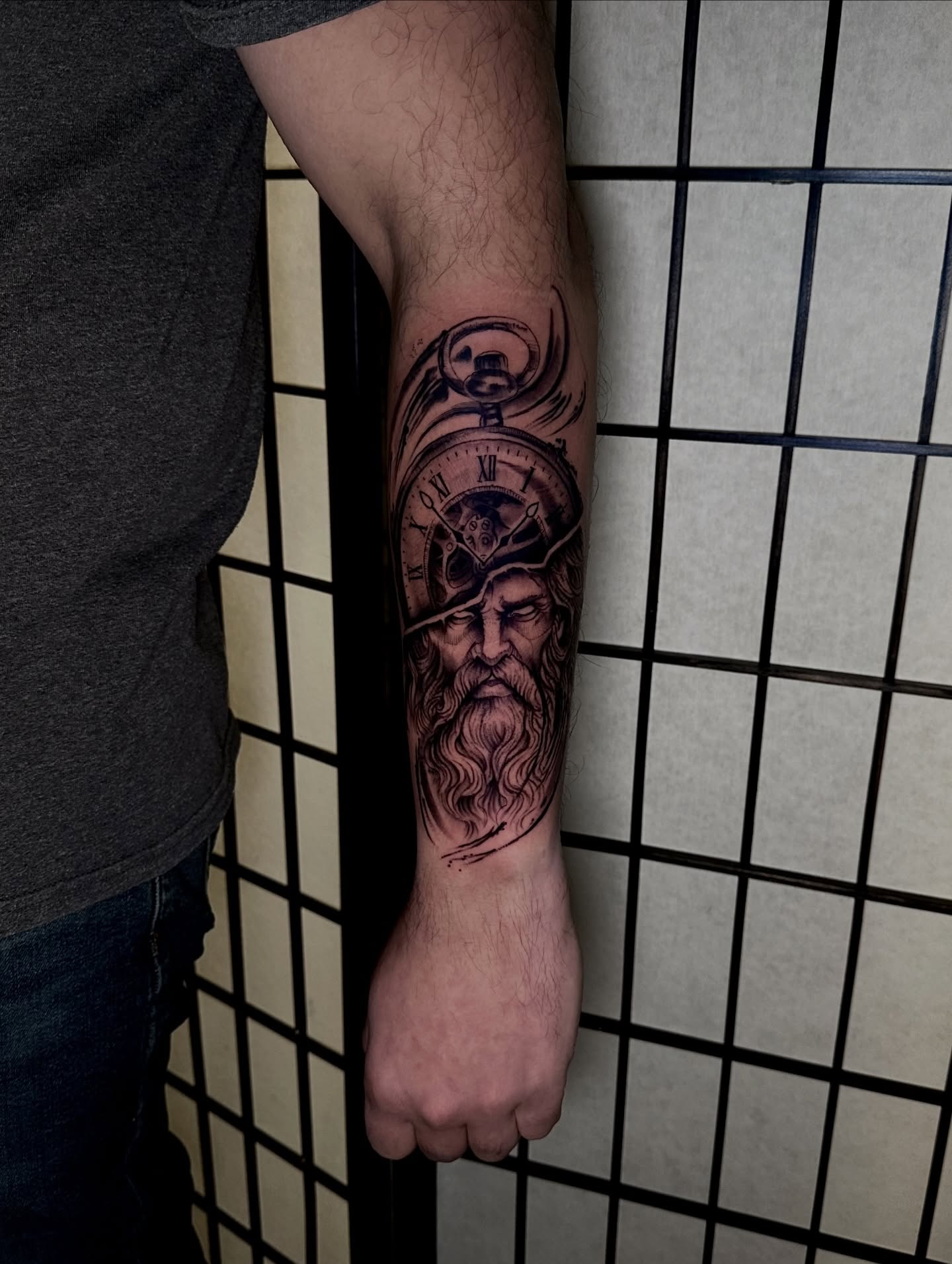 Bearded man with pocket watch realism tattoo on the forearm by Robert Douglas