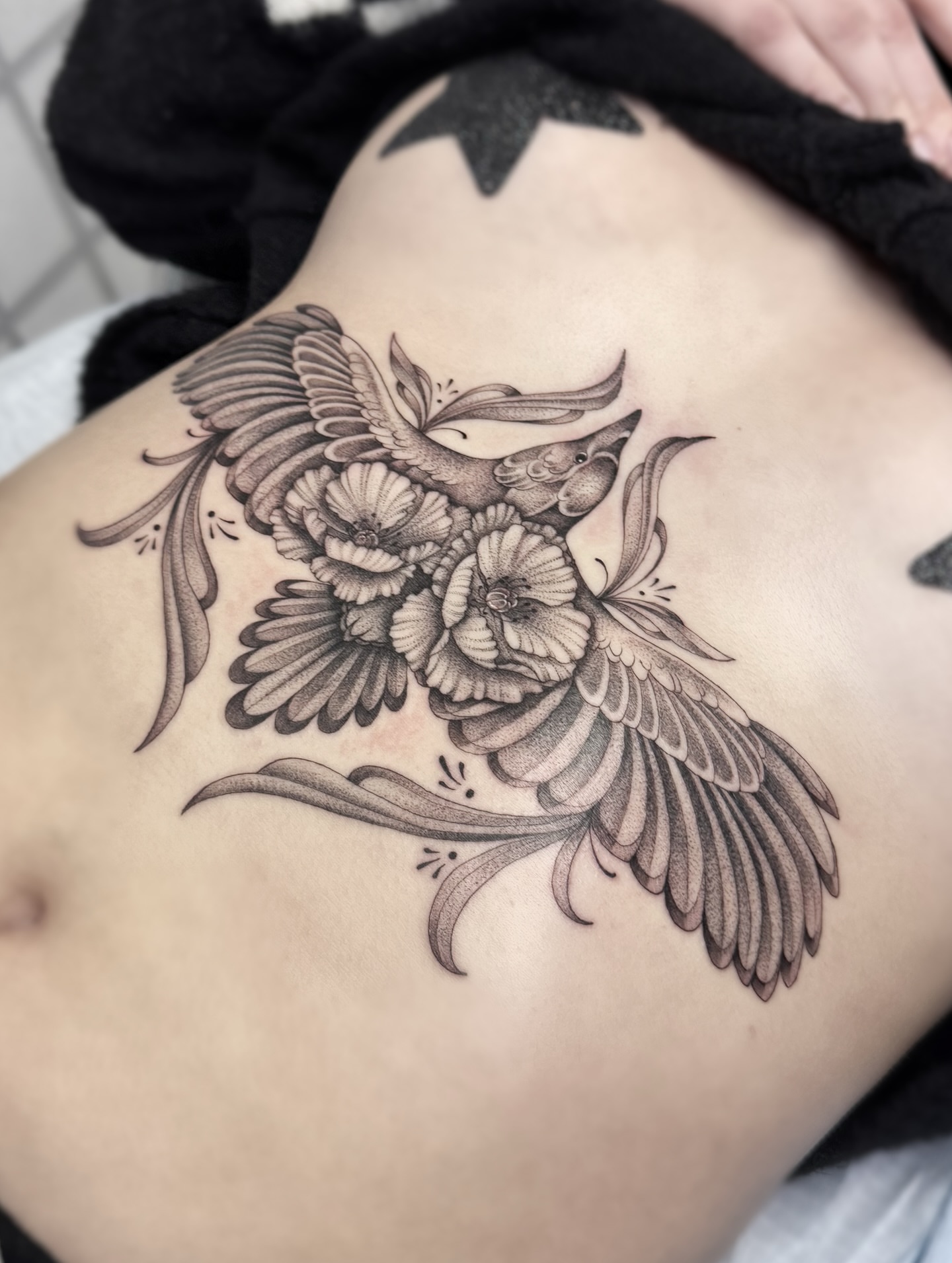 Bird and flowers black and grey tattoo on the ribs by MillaKas ° Tattoos